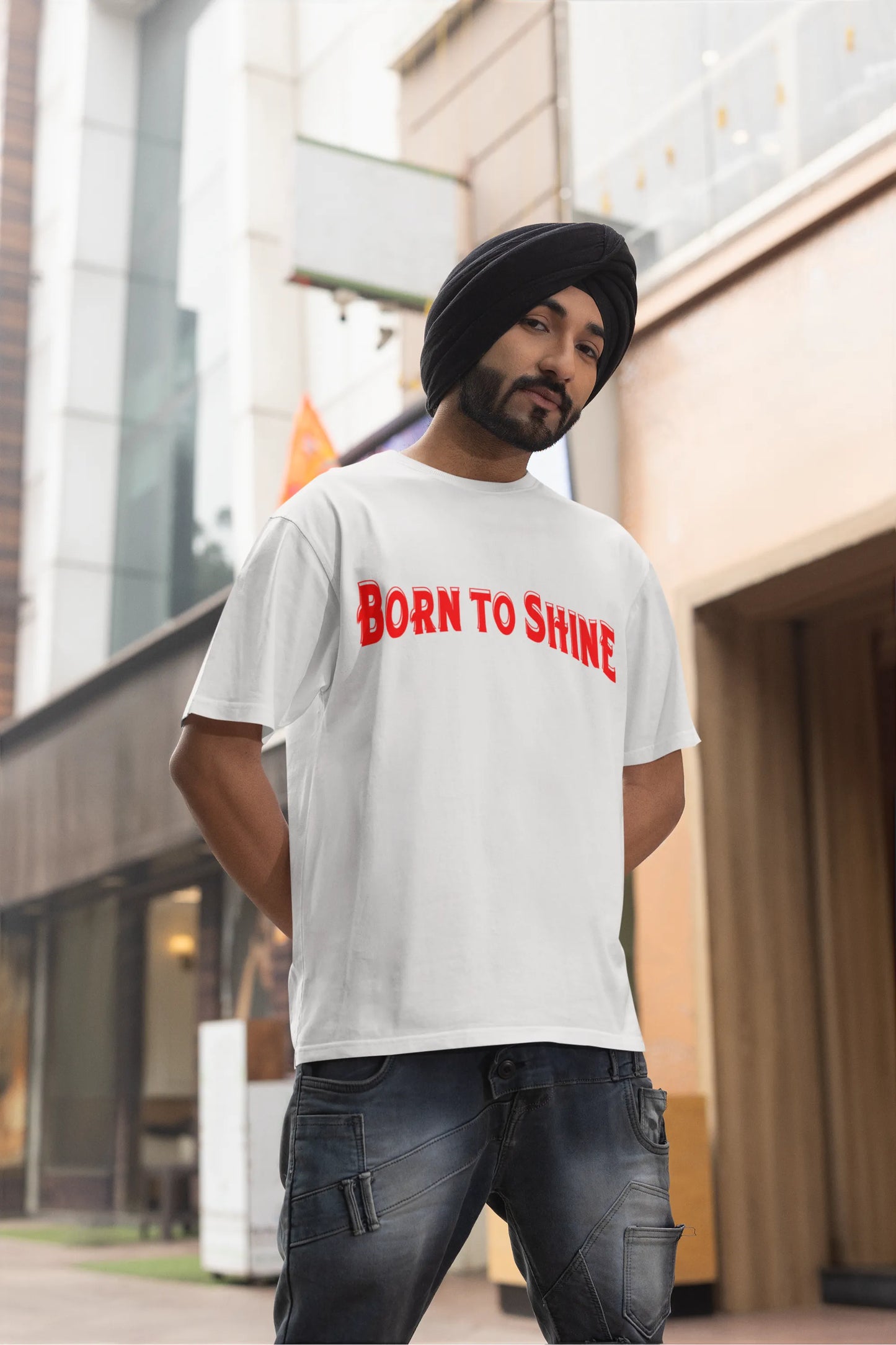Third front image of a male model wearing a off-white oversized t-shirt featuring a Diljit Dosanjh-inspired design with the text "Born to Shine."