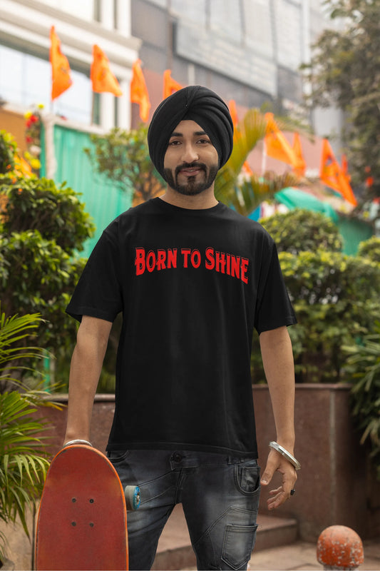 Second front image of a male model wearing a black oversized t-shirt featuring a Diljit Dosanjh-inspired design with the text "Born to Shine."