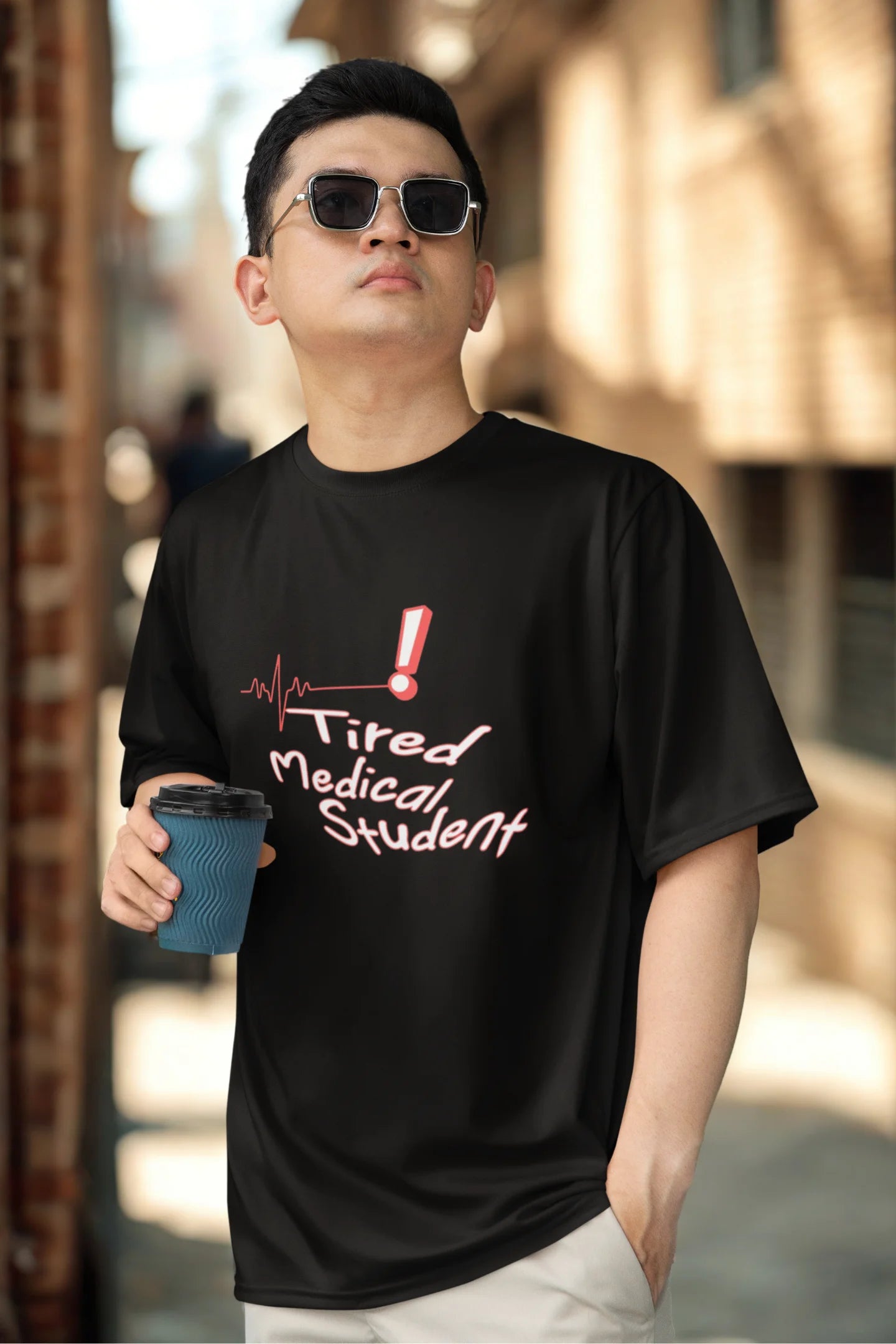 Tired Medico | Medico | Dropped Sleeve Unisex Tee