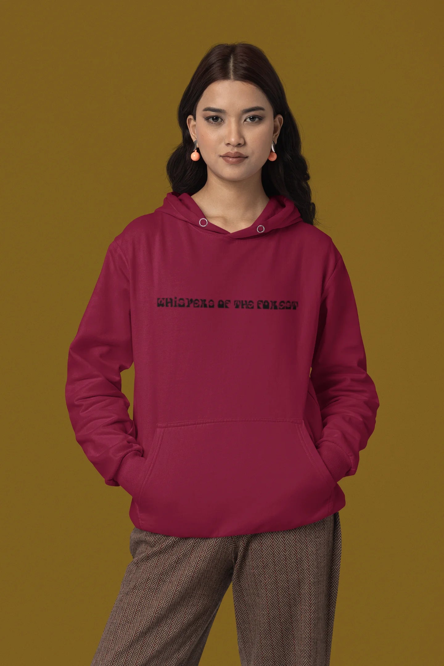 Fourth front view of a female model wearing a maroon hoodie with a design featuring three different types of butterflies, symbolizing the beauty and diversity of nature.