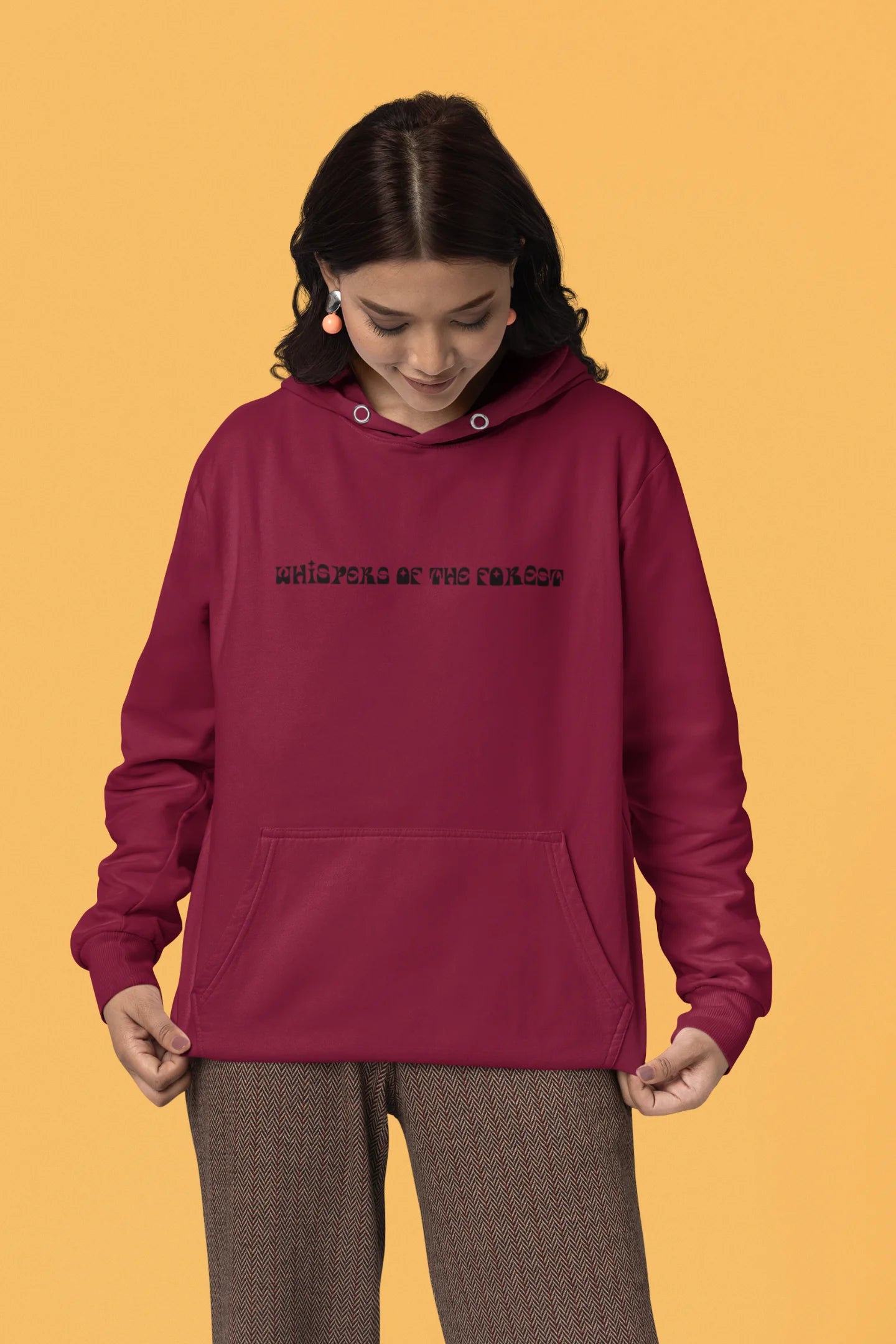 Second front view of a female model wearing a maroon hoodie with a design featuring three different types of butterflies, symbolizing the beauty and diversity of nature.