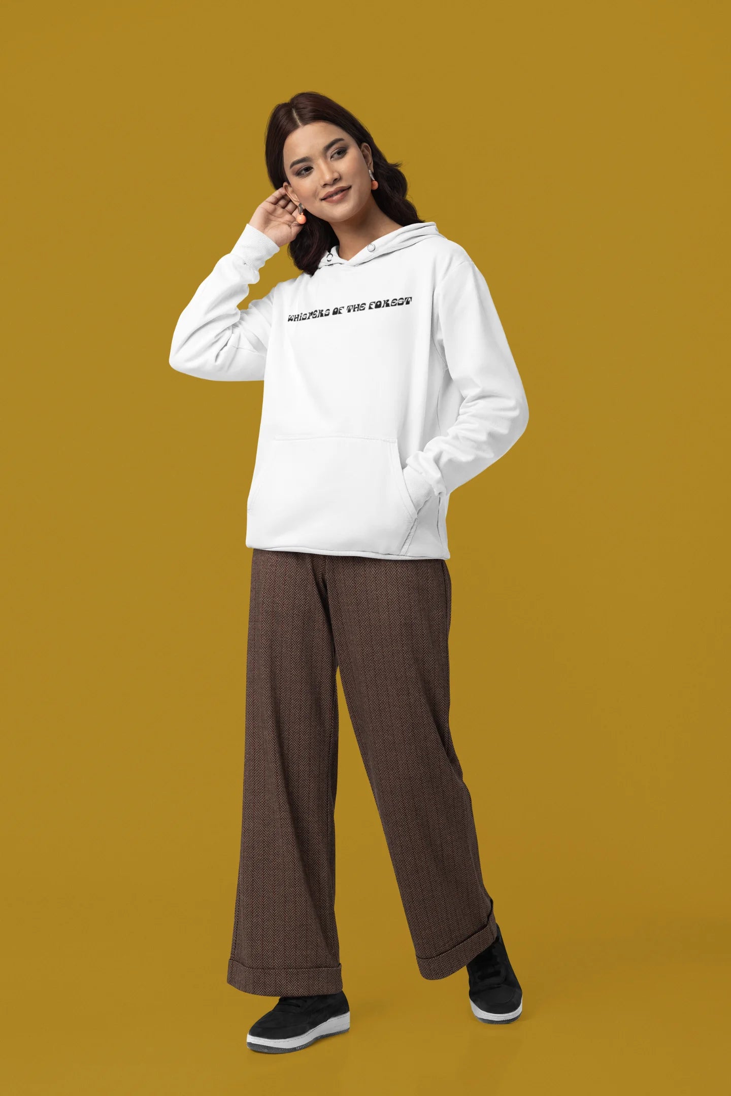 Third front view of a female model wearing a white hoodie with a design featuring three different types of butterflies, symbolizing the beauty and diversity of nature.