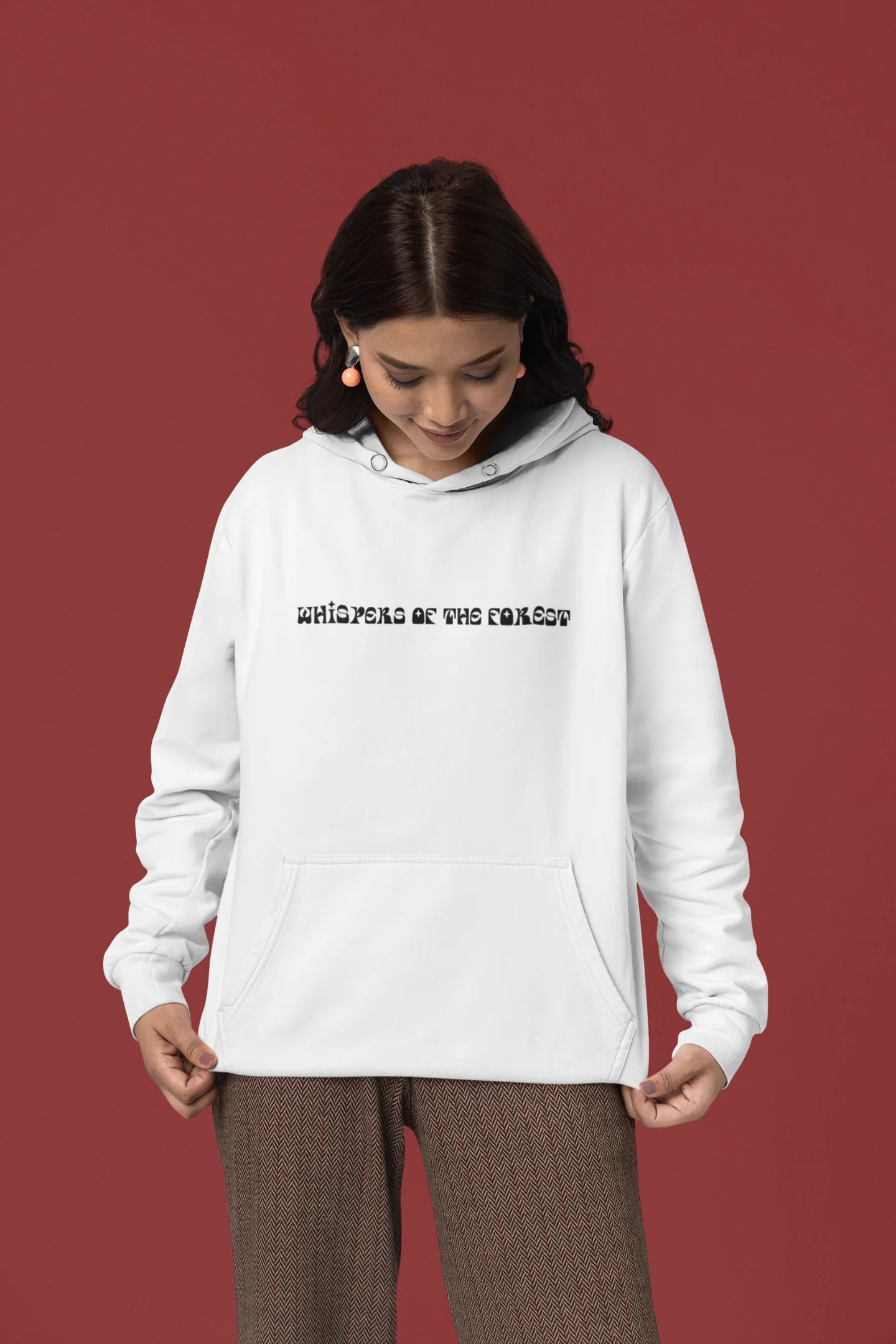 First front view of a female model wearing a white hoodie with a design featuring three different types of butterflies, symbolizing the beauty and diversity of nature.