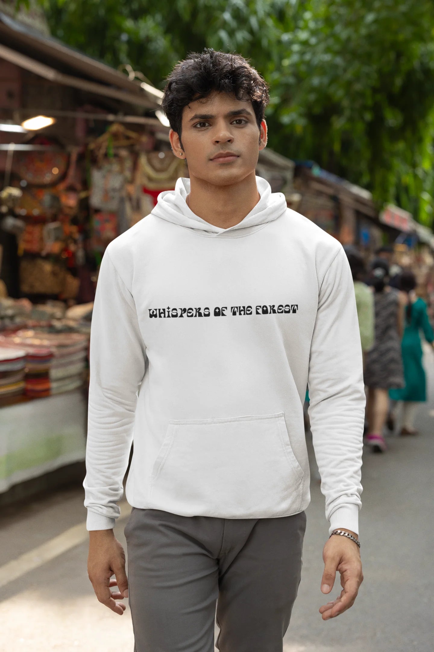 Second front view of a male model wearing a white hoodie with a design featuring three different types of butterflies, symbolizing the beauty and diversity of nature.