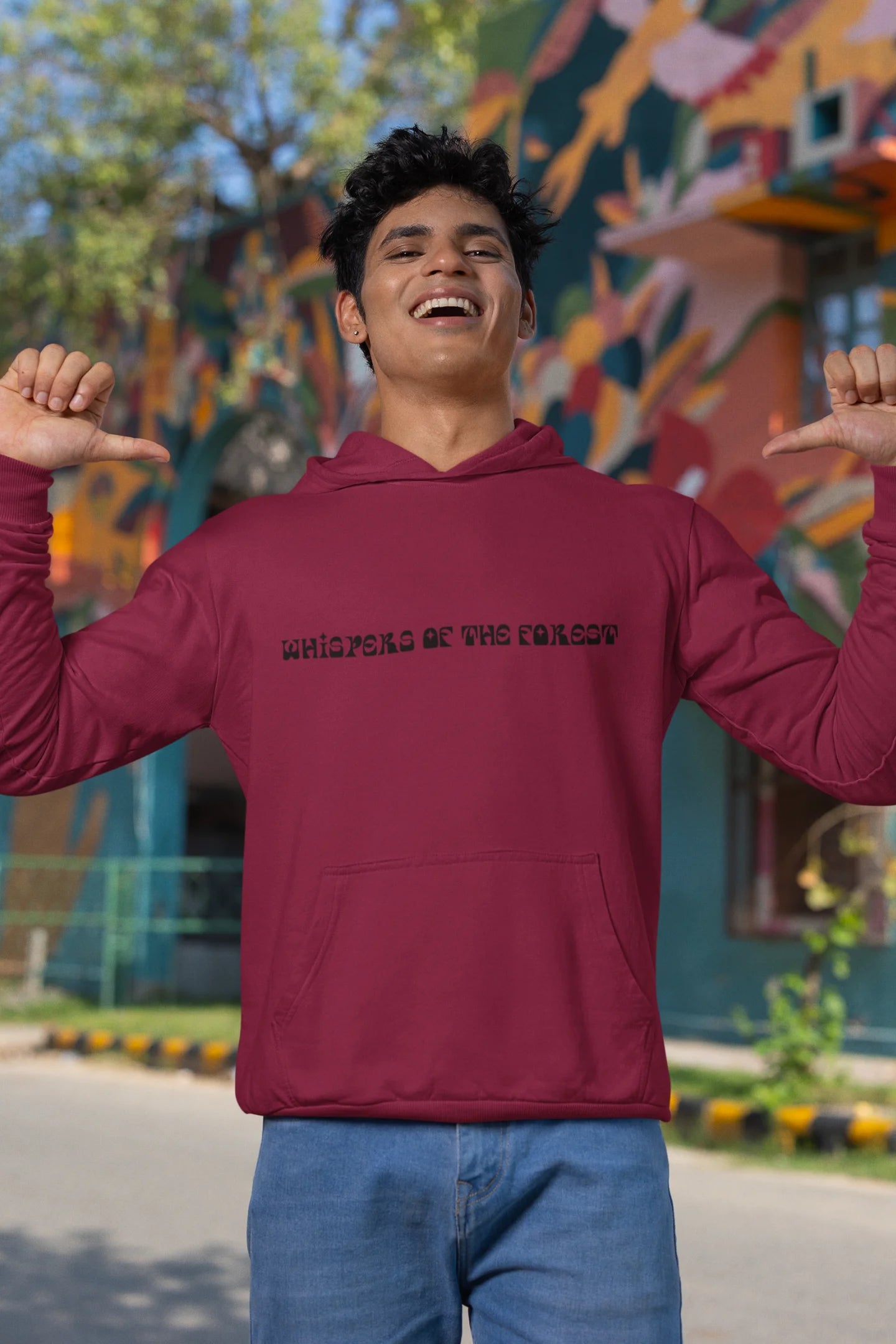 Third front view of a male model wearing a maroon hoodie with a design featuring three different types of butterflies, symbolizing the beauty and diversity of nature.