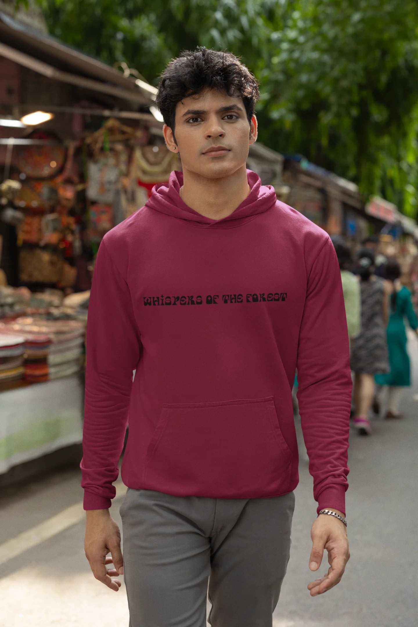 Second front view of a male model wearing a maroon hoodie with a design featuring three different types of butterflies, symbolizing the beauty and diversity of nature.