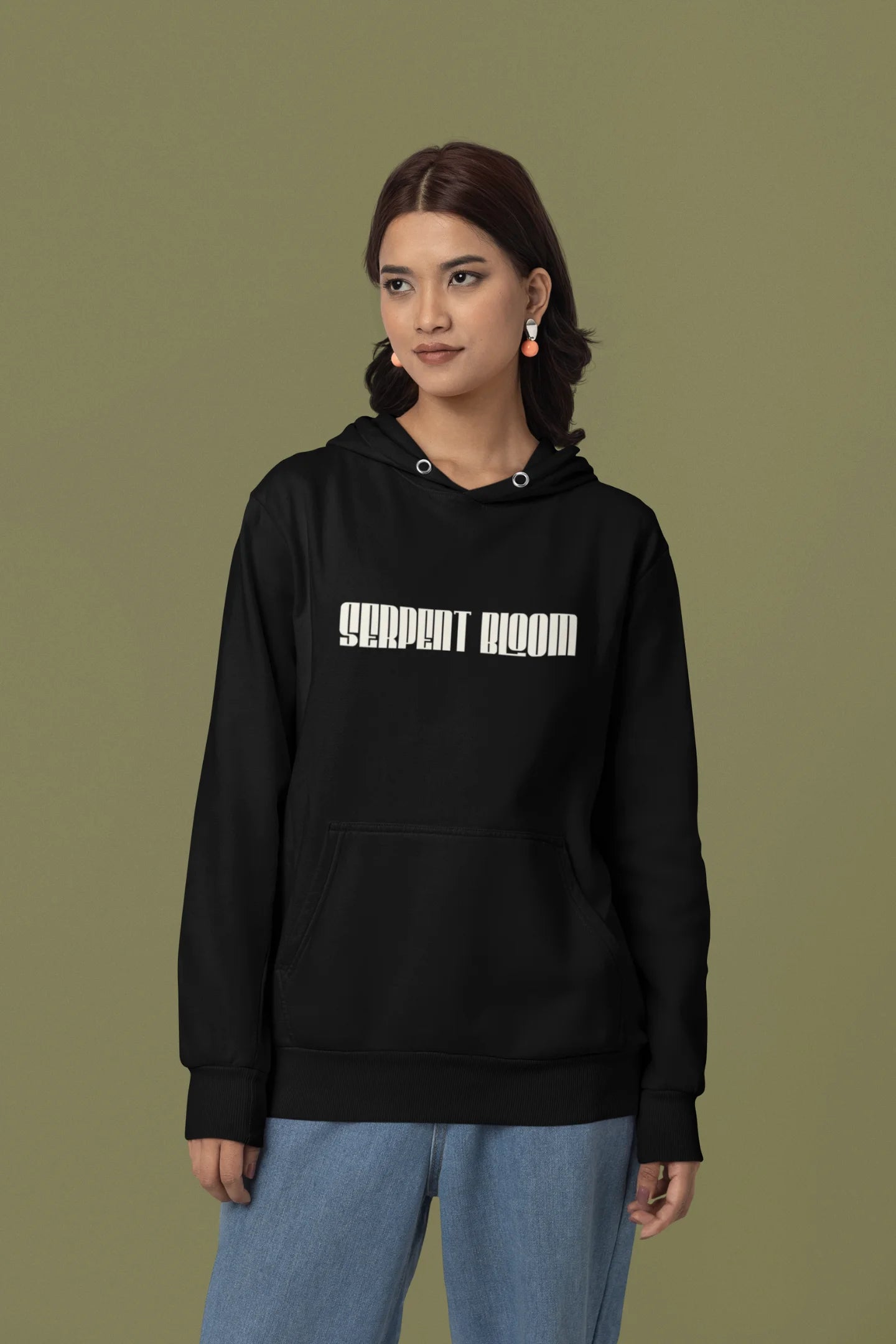 First front view of a female model wearing a black hoodie with a snake coiled around flowers, symbolizing the harmony between nature and its creatures.