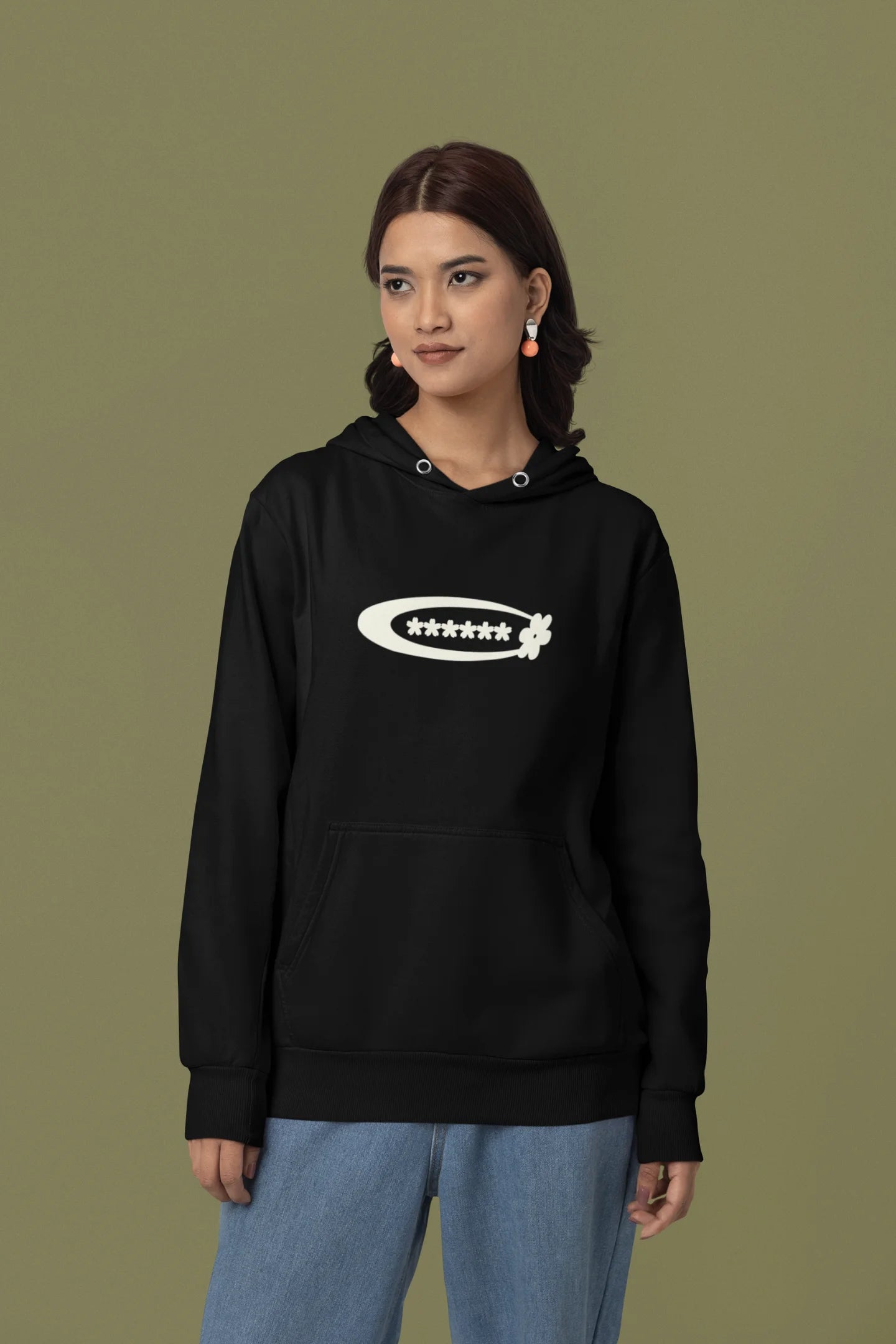 First front view of a female model model wearing a black hoodie with a design featuring berry bushes overflowing with fruit, symbolizing the abundance and beauty of nature.
