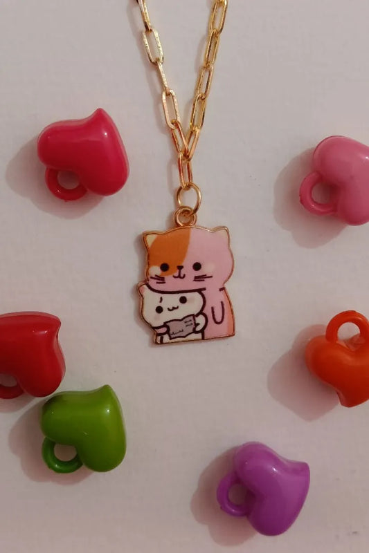 First view of an anti tarnish gold chain necklace featuring a design of a mother cat and her kitten.