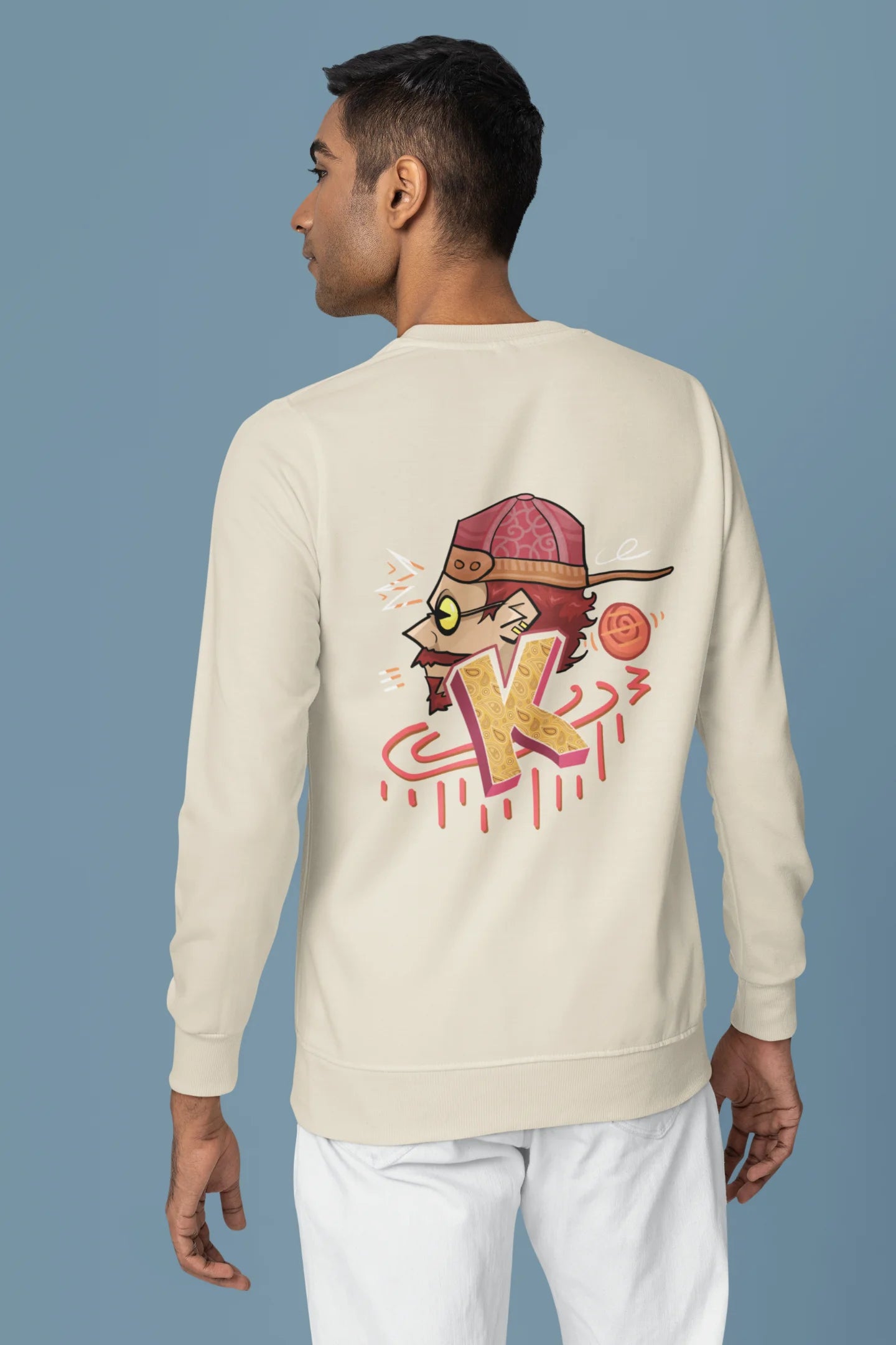 Back view of a male model wearing a cream oversized t-shirt featuring the Hindi word for "cool" with a unique, playful design.