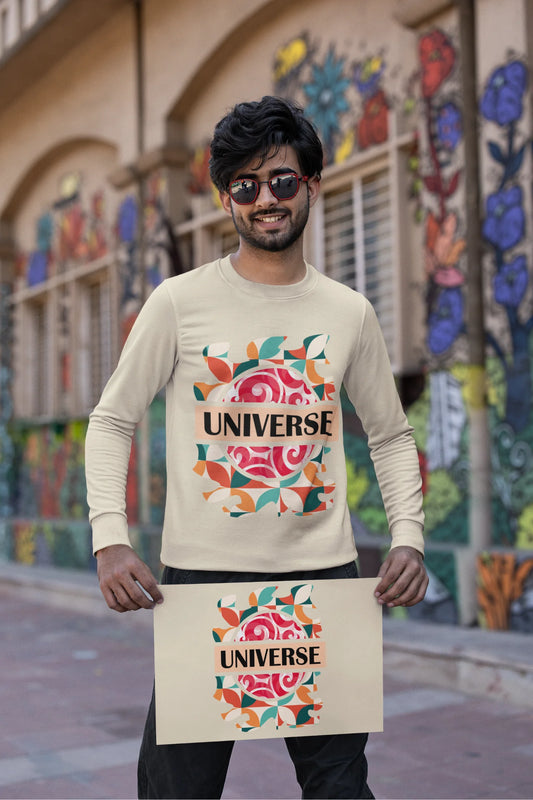 Second front view of a male model wearing an cream sweatshirt with a cosmic Universe design inspired by Coldplay.