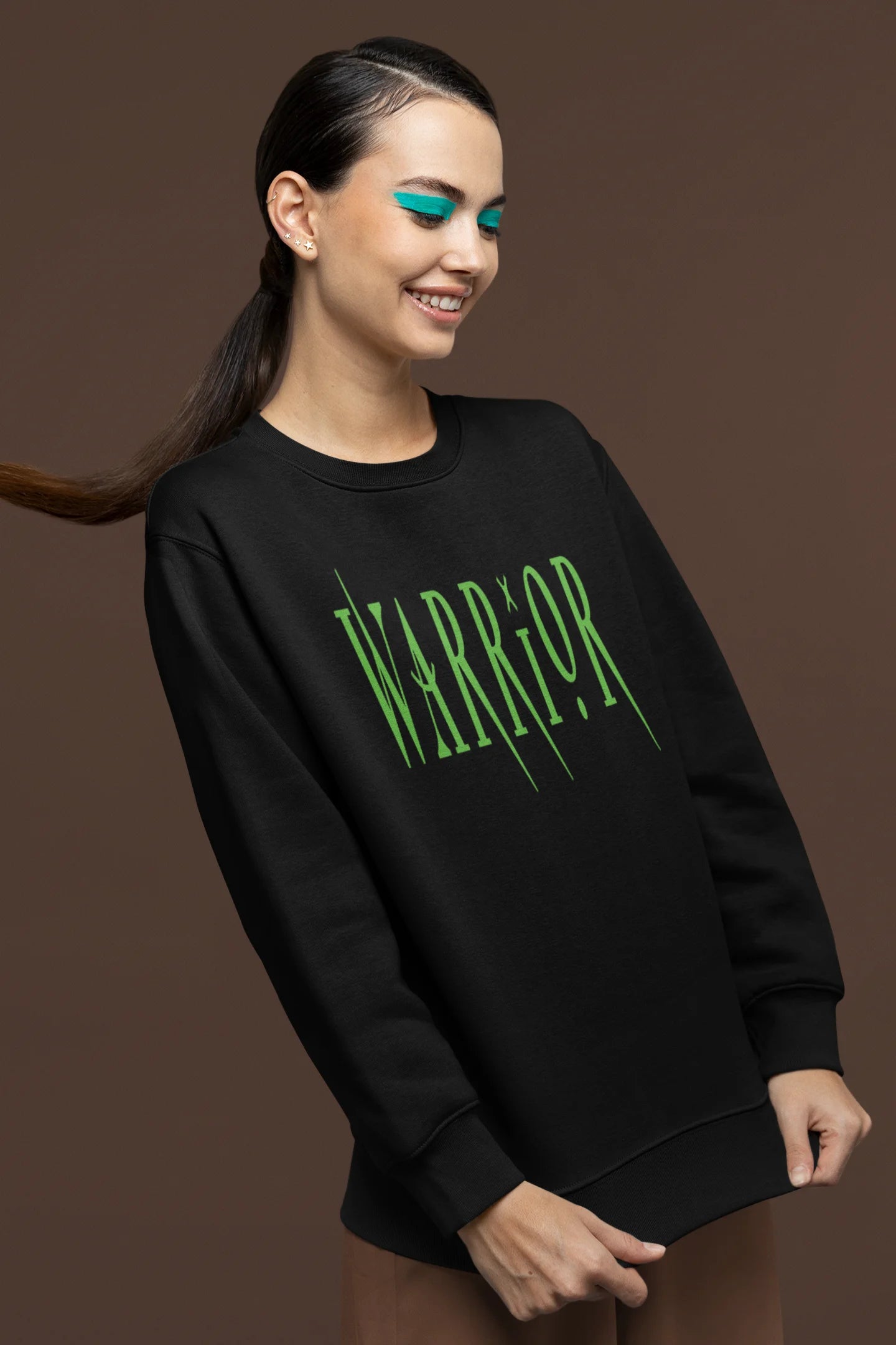 First front view of a female model wearing a black sweatshirt with a brutalist warrior and horseback battle design.