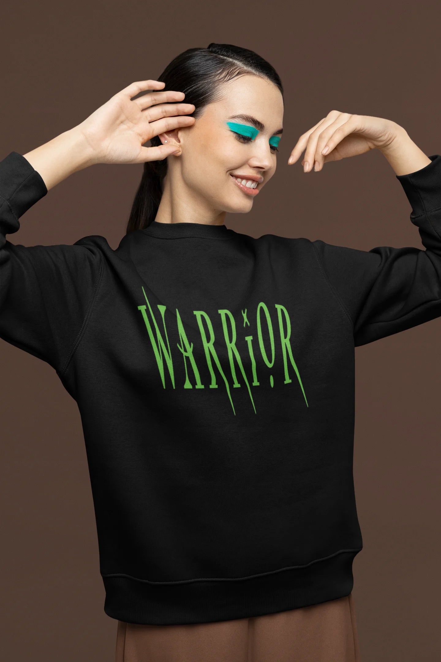 Second front view of a female model wearing a black sweatshirt with a brutalist warrior and horseback battle design.