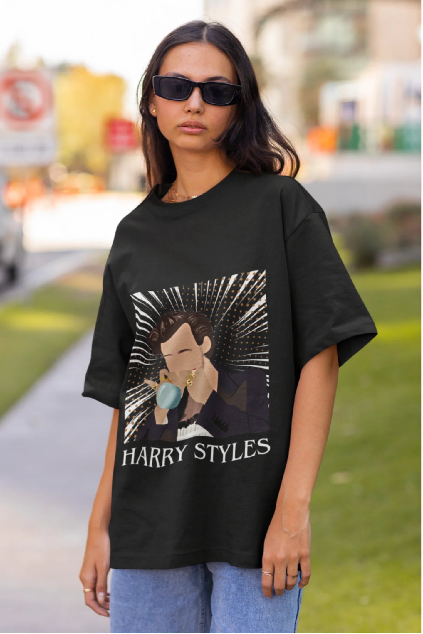 Second image of woman wearing One Direction-inspired black oversized t-shirt with Harry Styles design - ideal Harry Styles merch for fans of 1D and Harry Styles