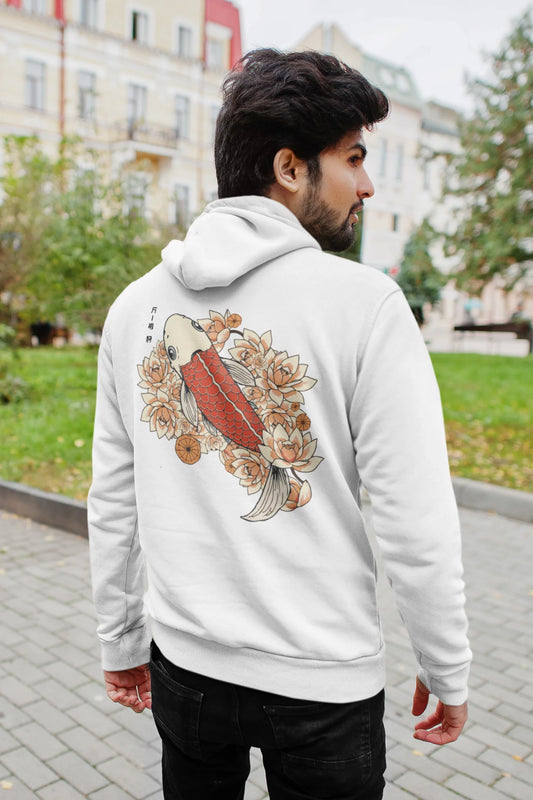 Back view of a male model wearing a white hoodie with a design of a koi fish swimming in a bed of flowers.