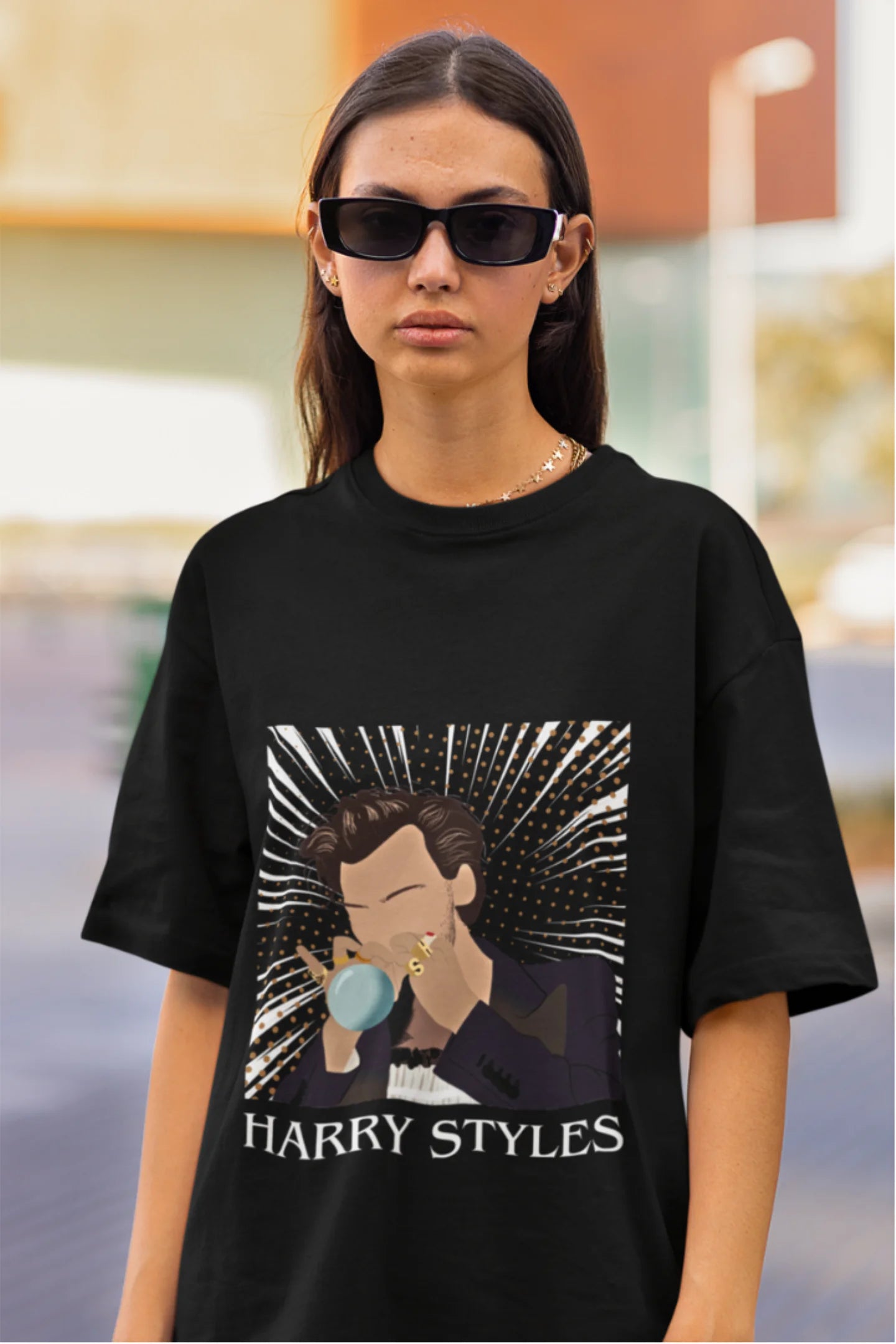 Third image of woman wearing One Direction-inspired black oversized t-shirt with Harry Styles design - ideal Harry Styles merch for fans of 1D and Harry Styles