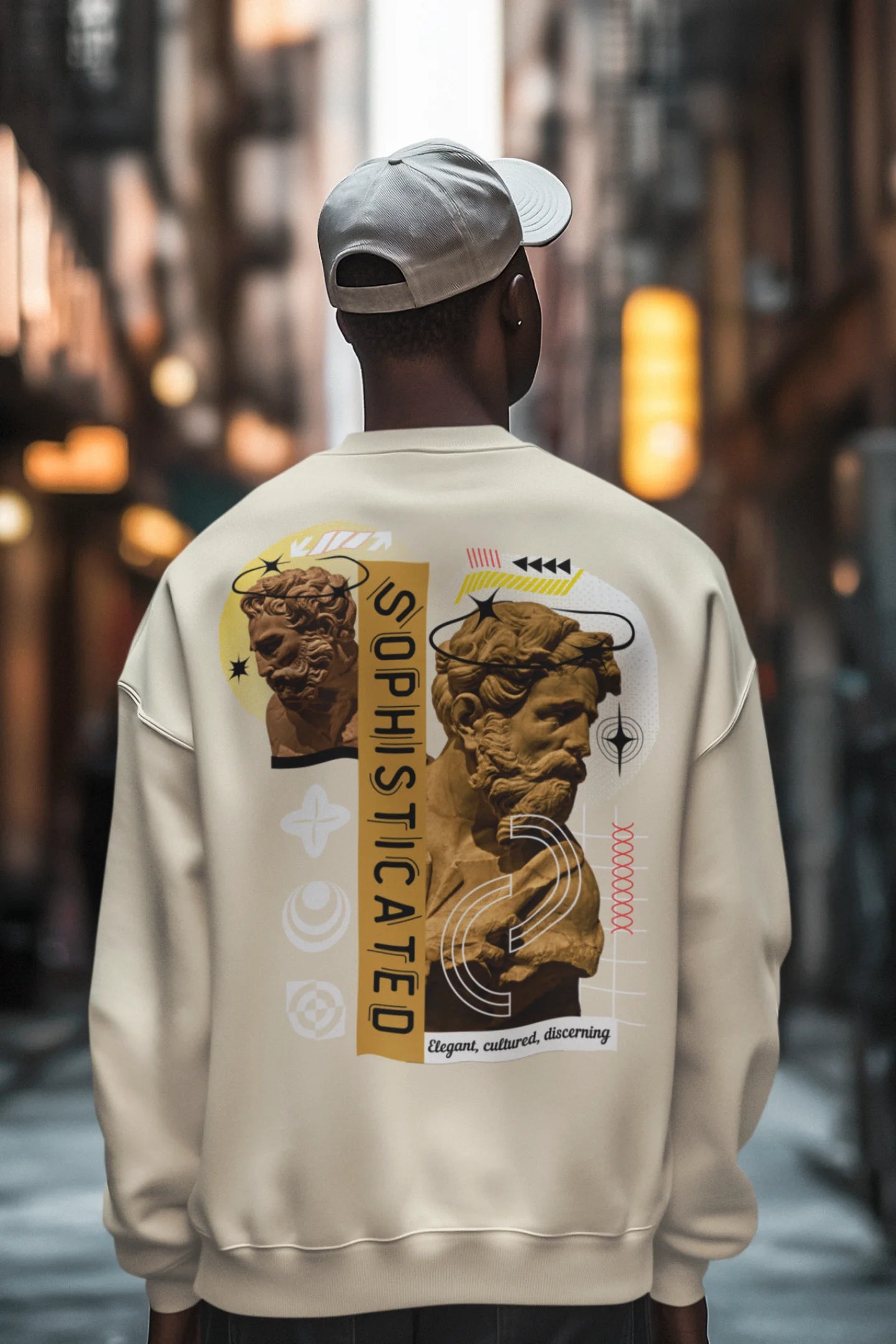 First back view of a male model wearing a cream sweatshirt with a sophisticated brutalist design featuring a Greek god statue.