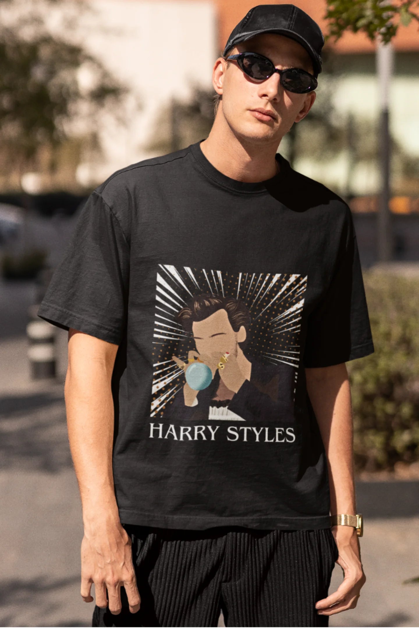 Third image of man wearing One Direction-inspired black oversized t-shirt with Harry Styles design - ideal Harry Styles merch for fans of 1D and Harry Styles