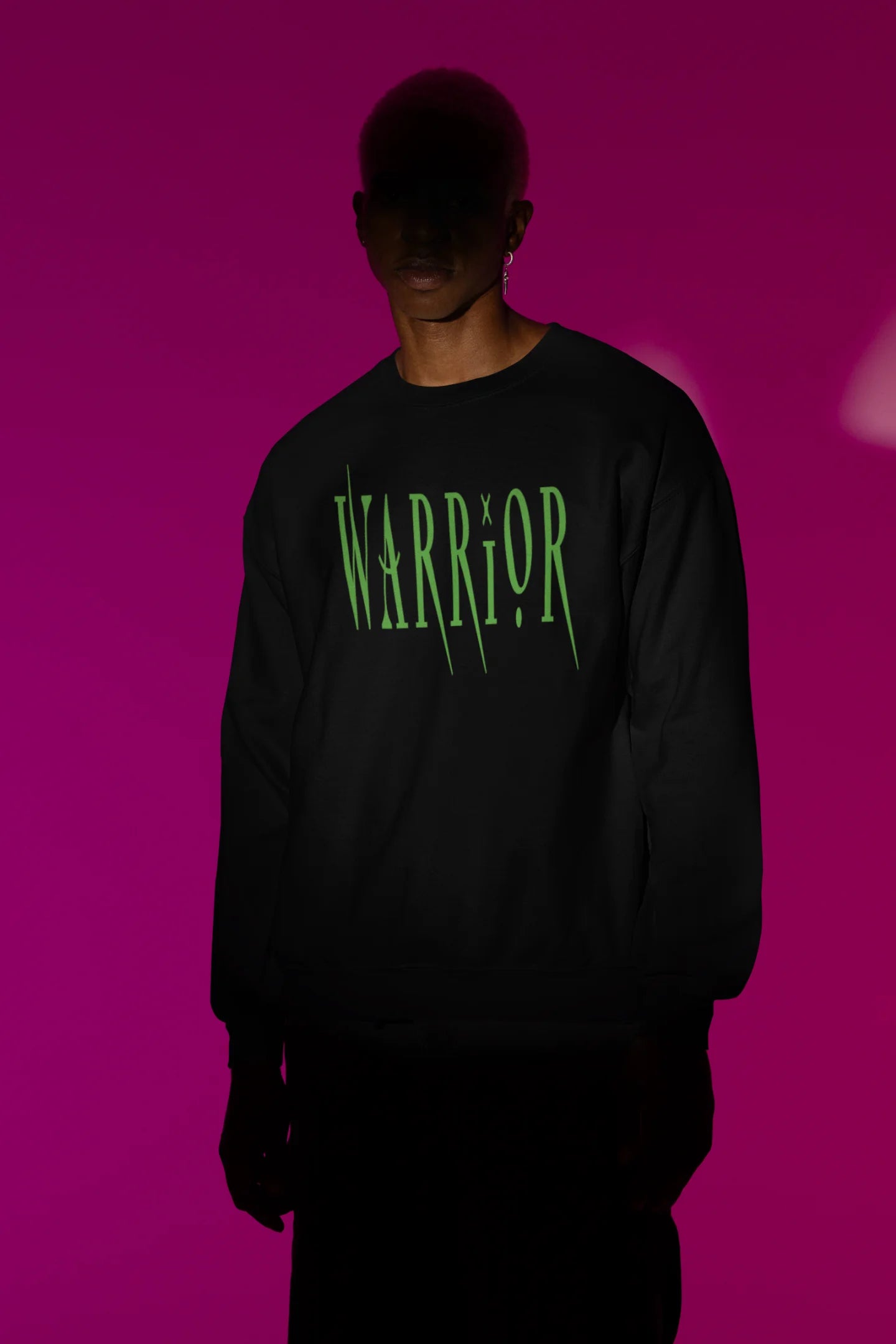 First front view of a male model wearing a black sweatshirt with a brutalist warrior and horseback battle design.