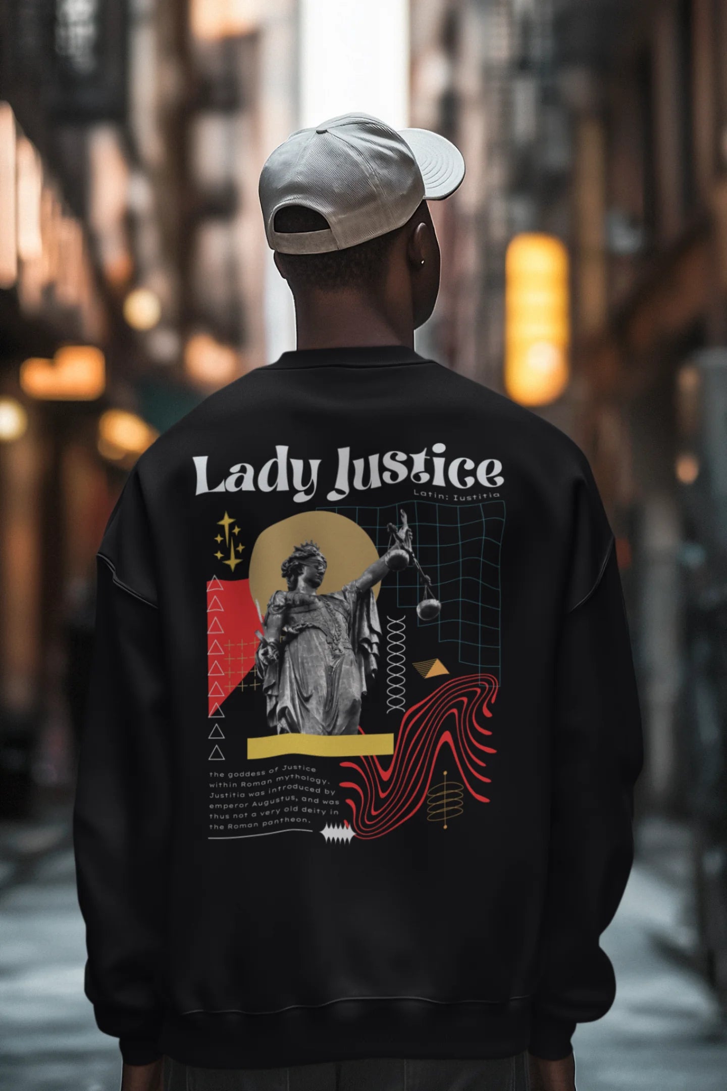 Second back view of a male model wearing a black sweatshirt with a brutalist Lady Justice statue design.