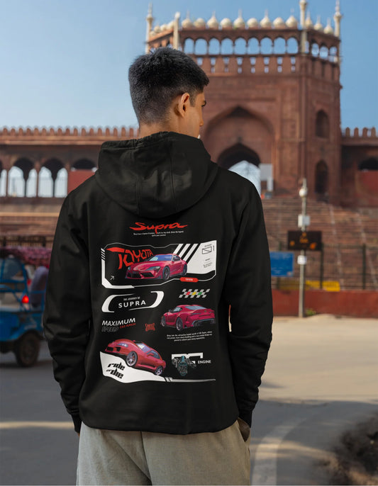 Back view of a male model wearing a black hoodie featuring a Toyota Supra design, exuding speed and power.