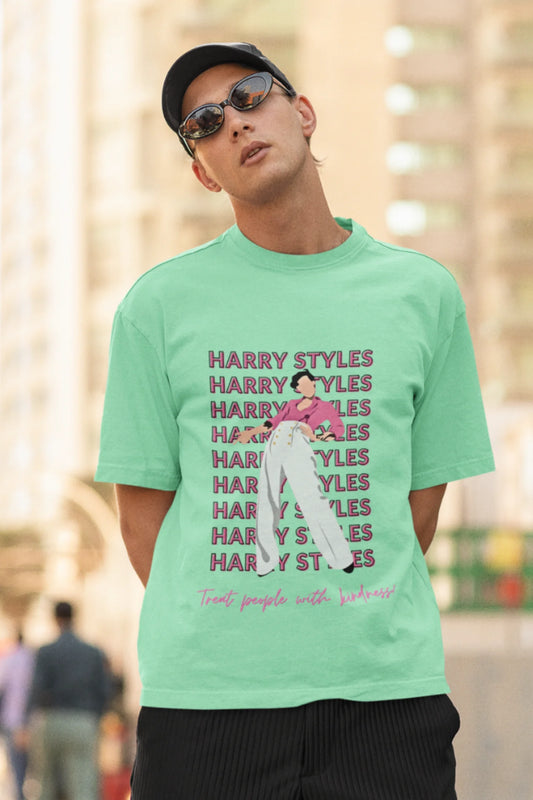 Second image of male model wearing mint green oversized t-shirt inspired by Harry Styles, featuring the 'Treat People with Kindness' mantra from the Fine Line collection.