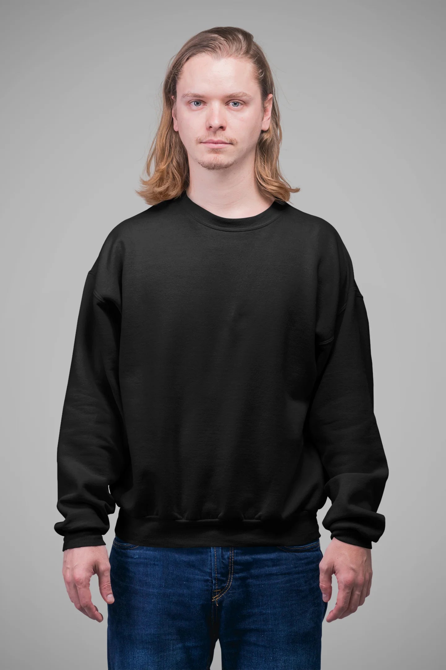 3rd front view of a male model wearing a trendy black sweatshirt featuring a pineapple wearing sunglasses with the slogan Stay Cool.