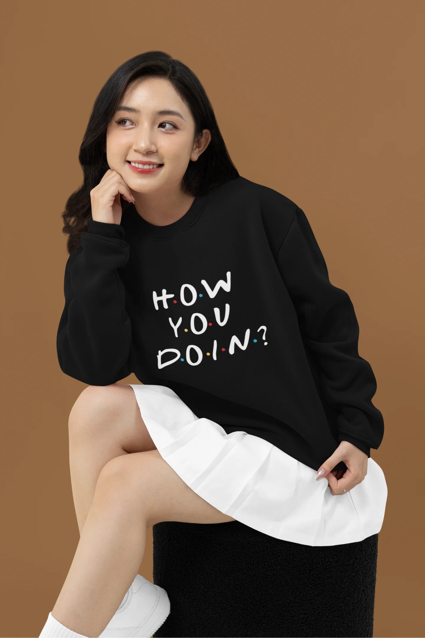 Second image of female model wearing black sweatshirt with F.R.I.E.N.D.S series inspired designs, embodying Joey's famous catchphrase 'How You Doin'?
