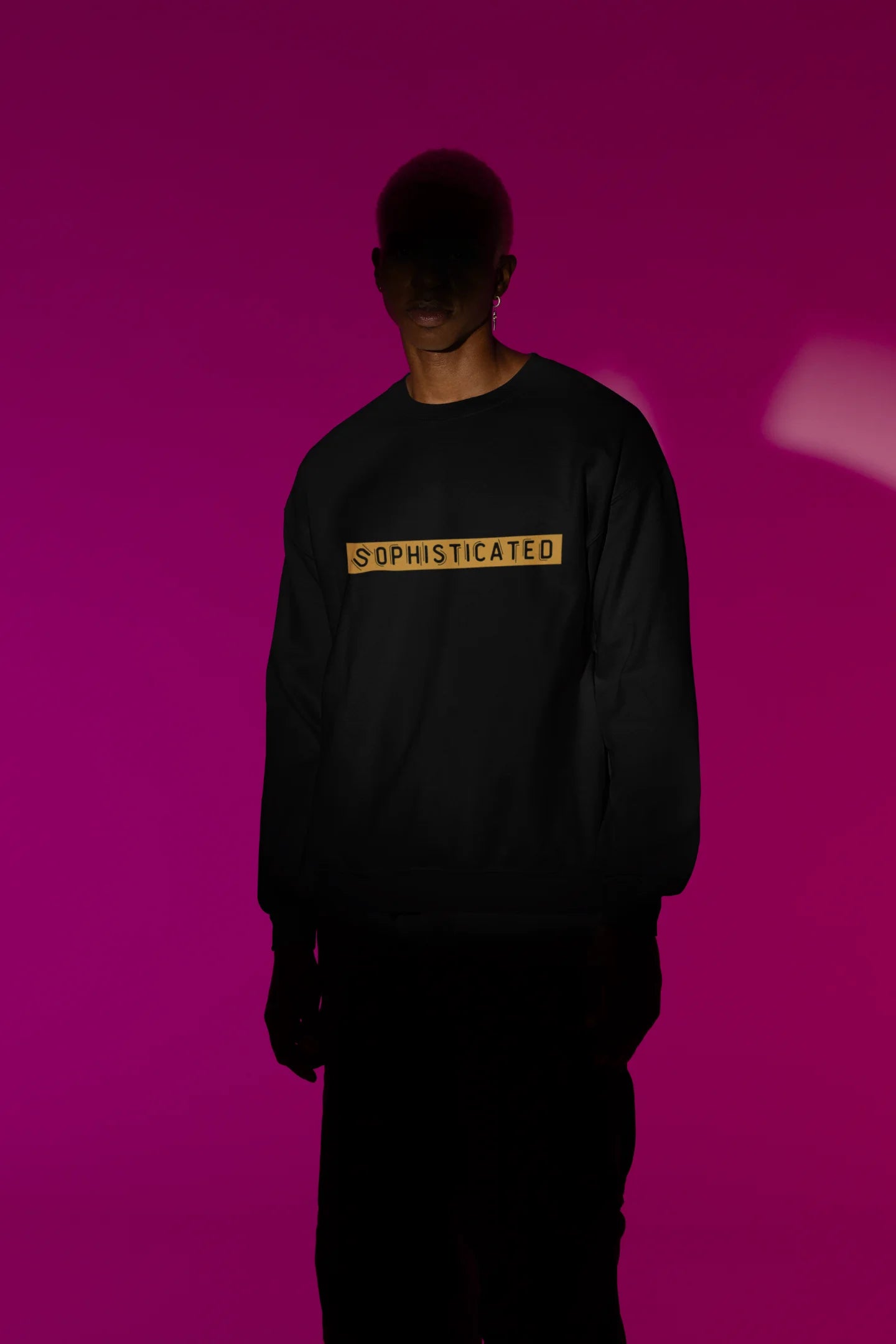 First front view of a male model wearing a black sweatshirt with a sophisticated brutalist design featuring a Greek god statue.