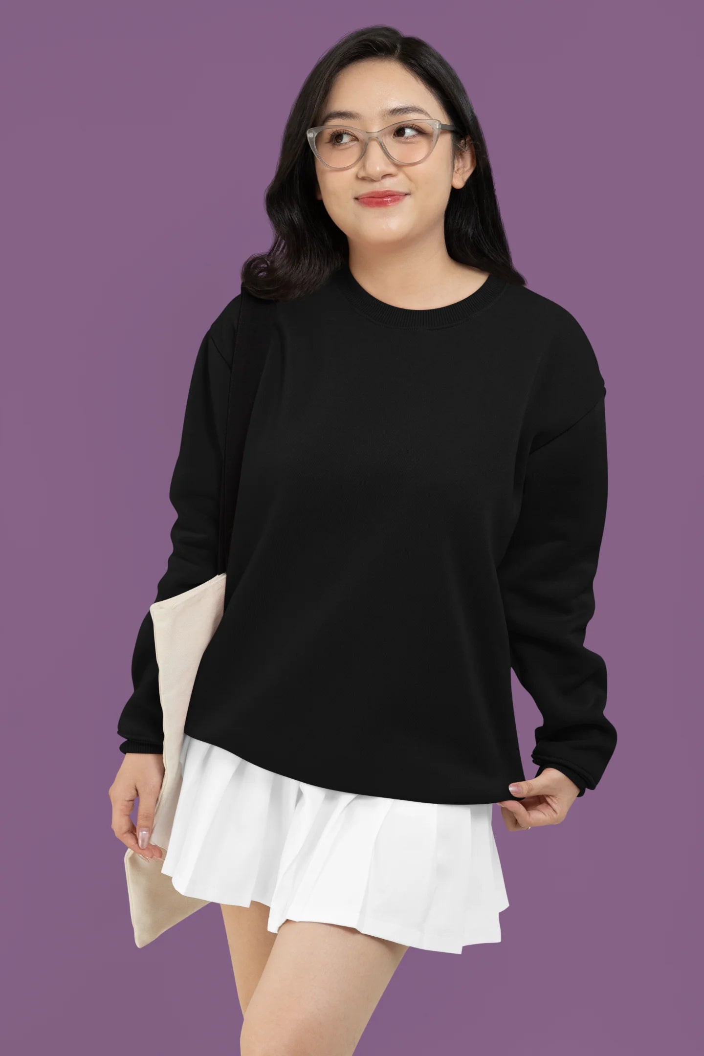 4th front view of a female model wearing a trendy black sweatshirt featuring a pineapple wearing sunglasses with the slogan Stay Cool.