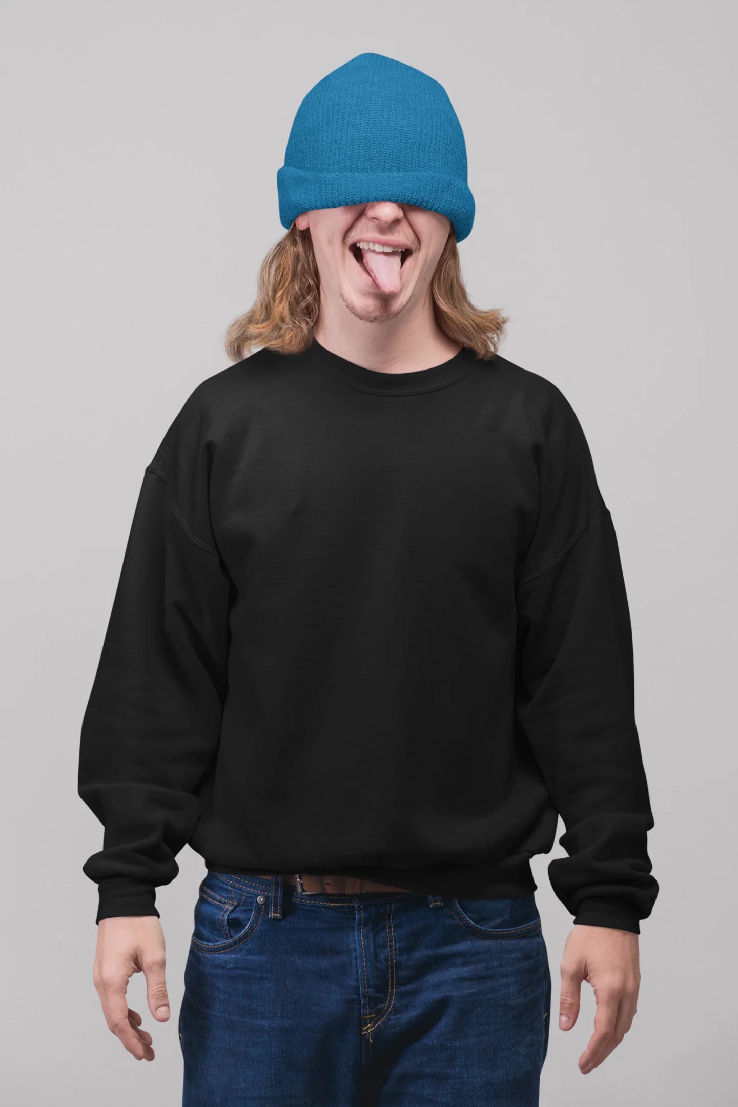 3rd front view of a male model wearing an black sweatshirt featuring colorful "Dream Without Limits" text, offering an inspiring and uplifting aesthetic.