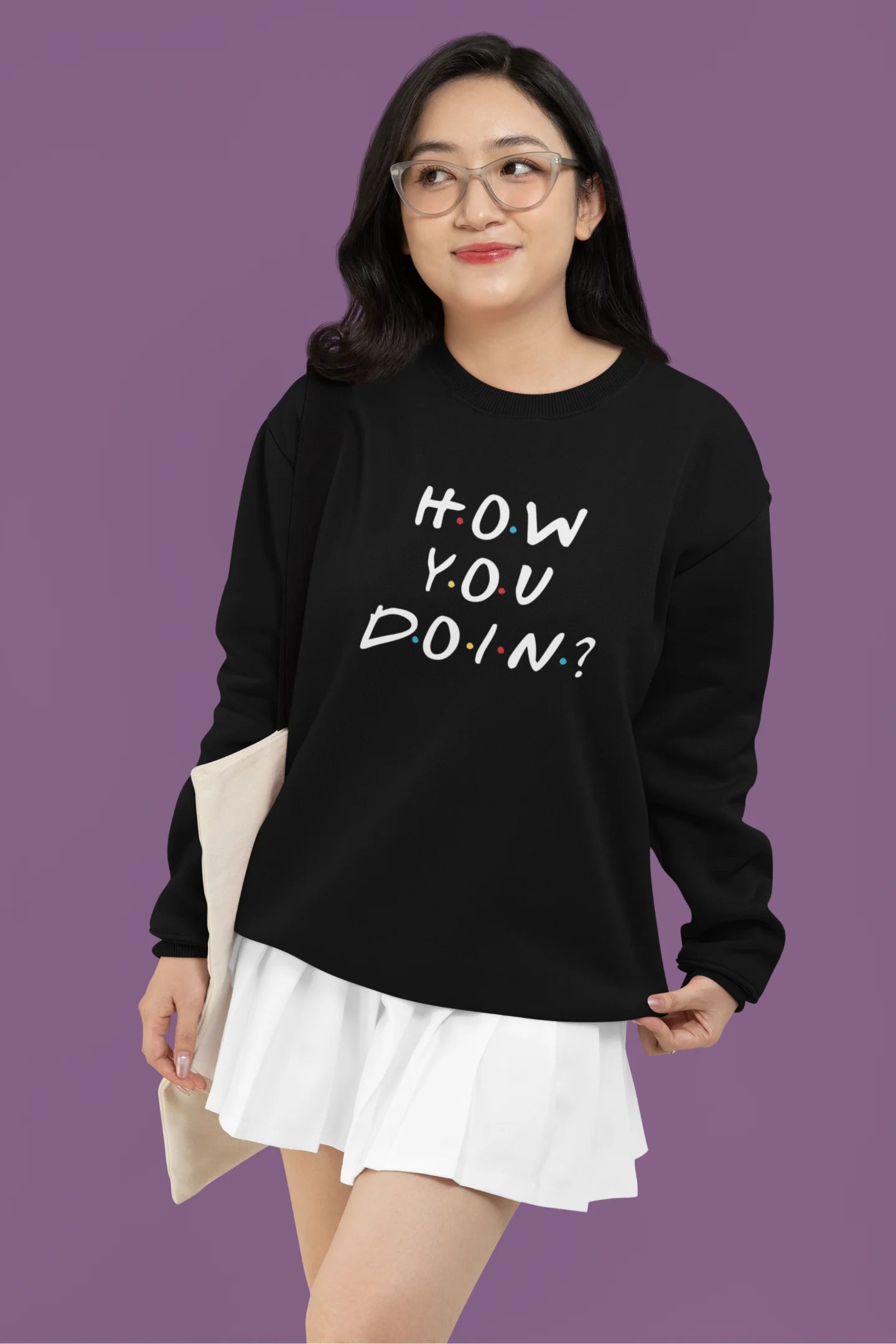 Third image of female model wearing black sweatshirt with F.R.I.E.N.D.S series inspired designs, embodying Joey's famous catchphrase 'How You Doin'?