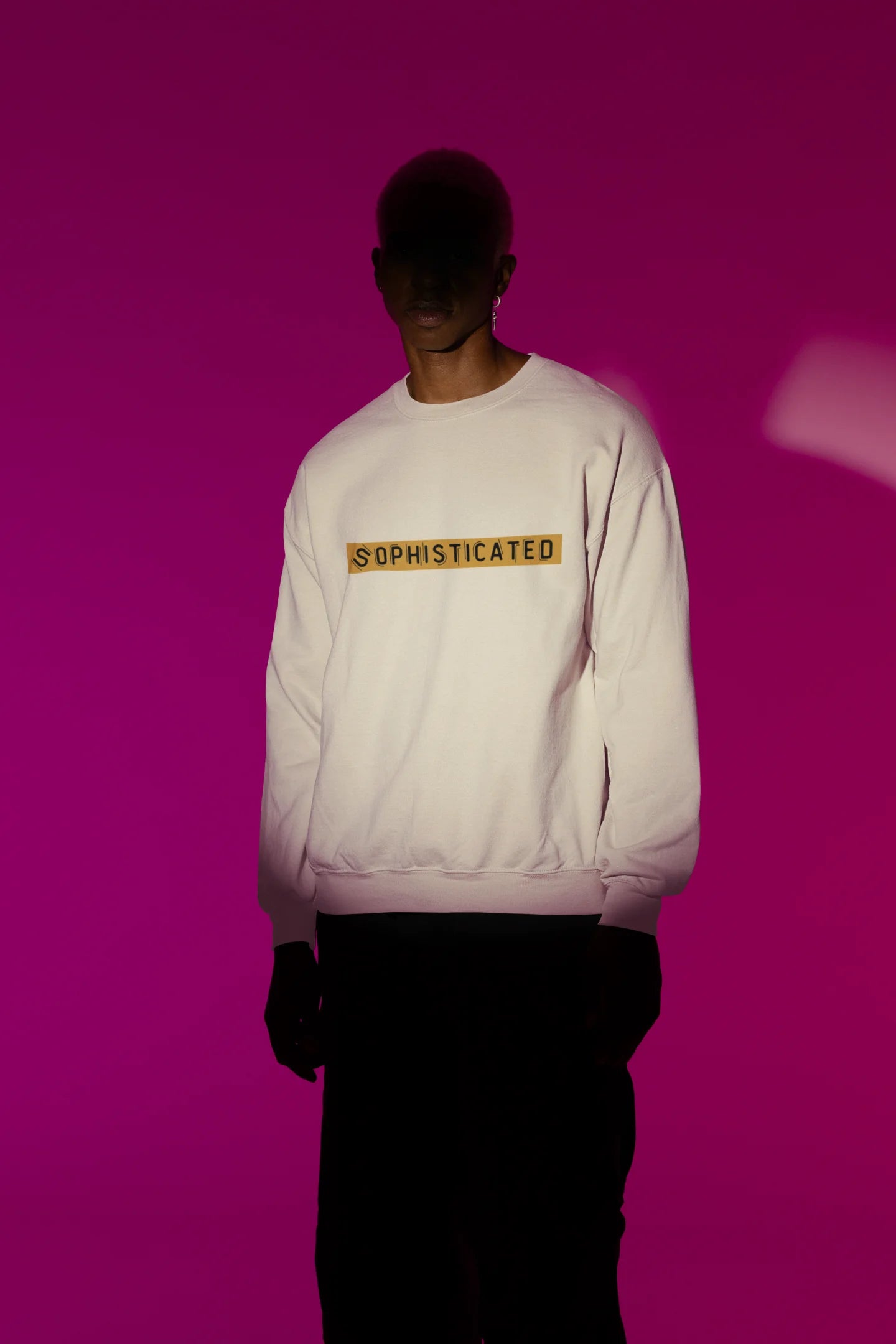 First front view of a male model wearing a cream sweatshirt with a sophisticated brutalist design featuring a Greek god statue.