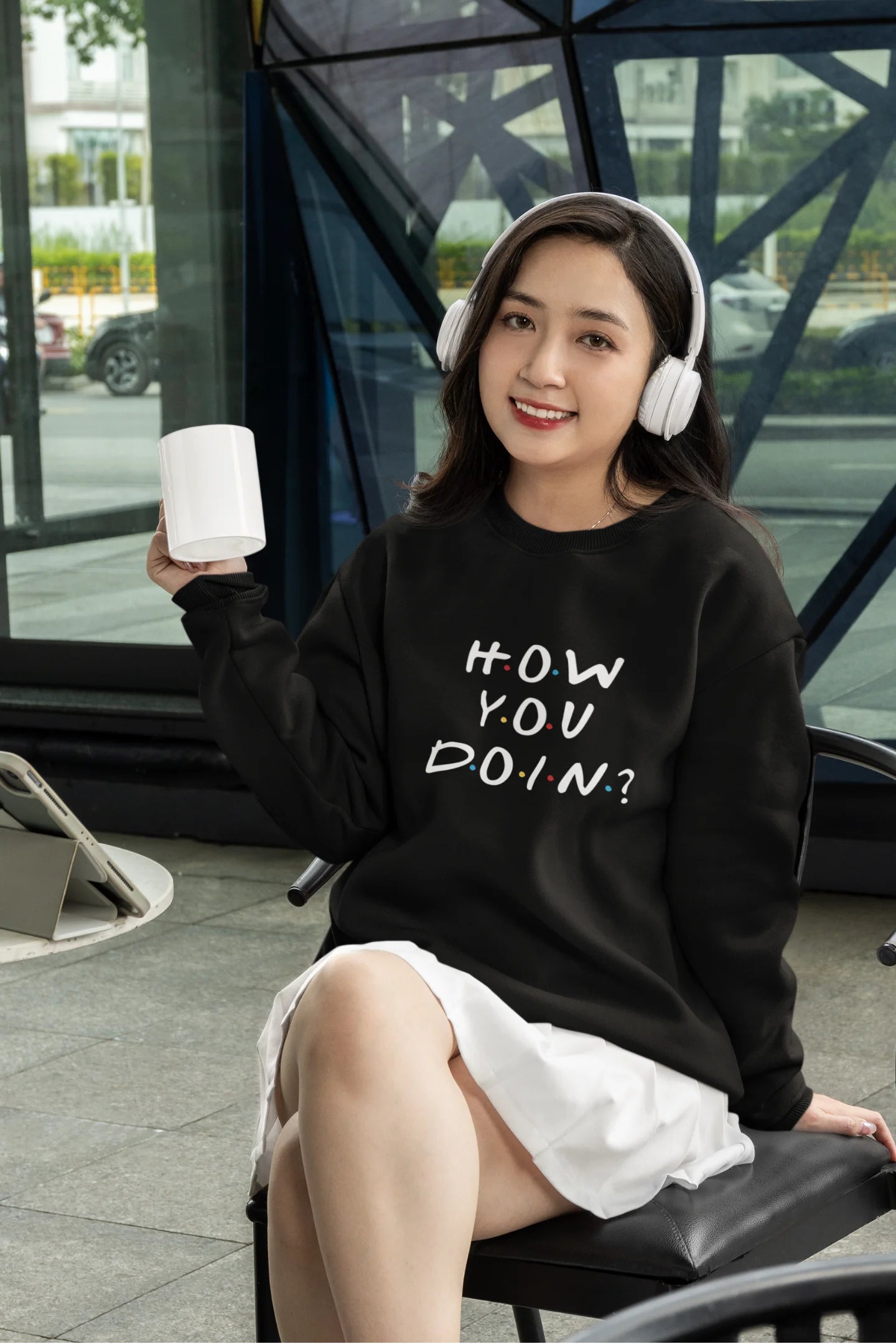 Fourth image of female model wearing black sweatshirt with F.R.I.E.N.D.S series inspired designs, embodying Joey's famous catchphrase 'How You Doin'?