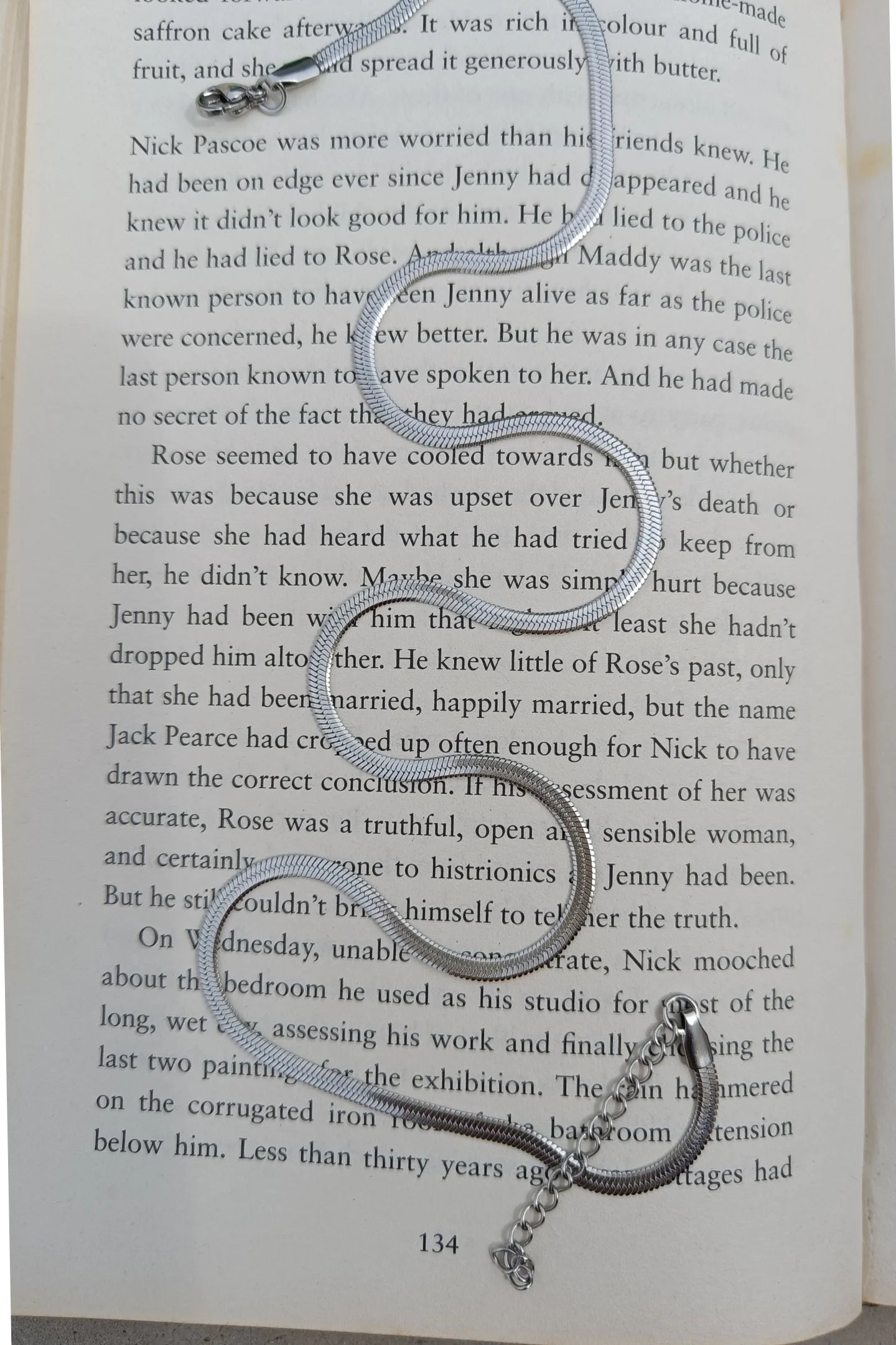 Sixth image of an anti tarnish silver chain necklace featuring a snake like design.