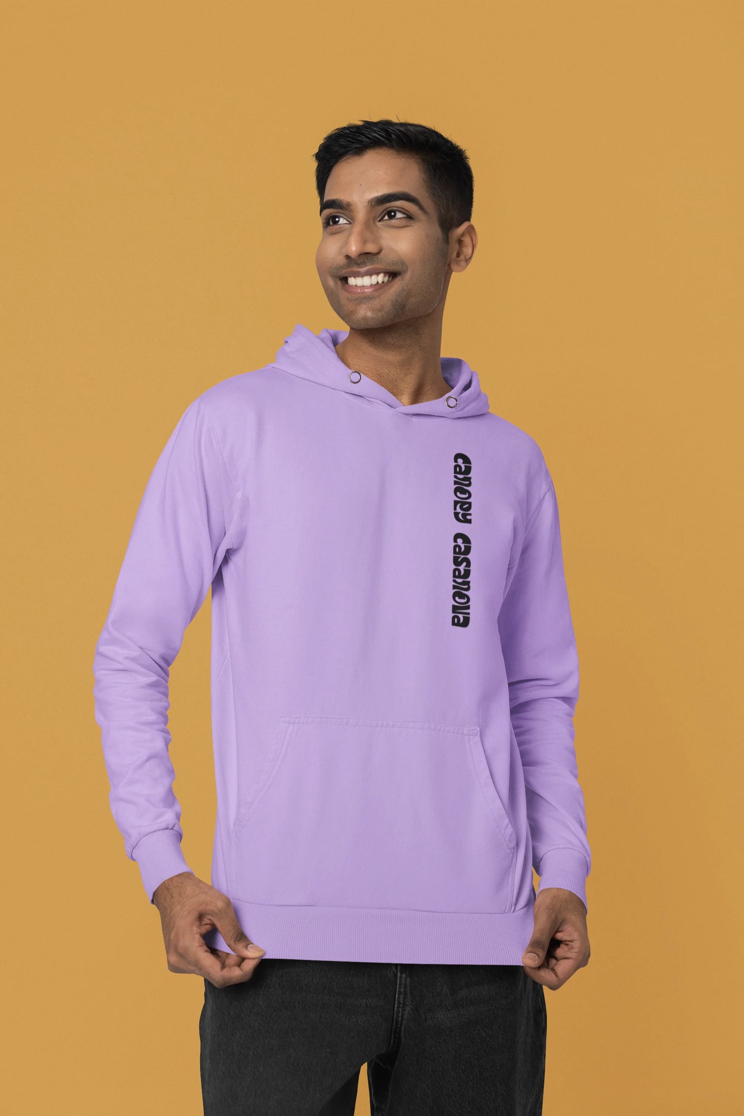Second front view of a male model wearing a lavender hoodie with a toucan perched on a branch in a jungle setting.