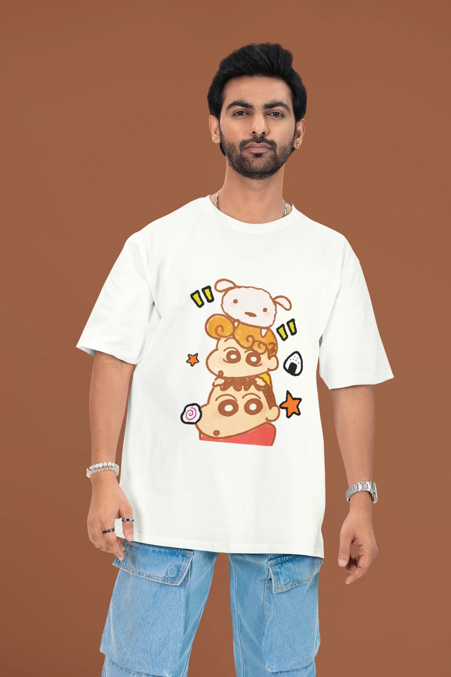 3rd front view of a male model wearing a off-white oversized t-shirt featuring Shinchan, Bo-chan, and Shero together.