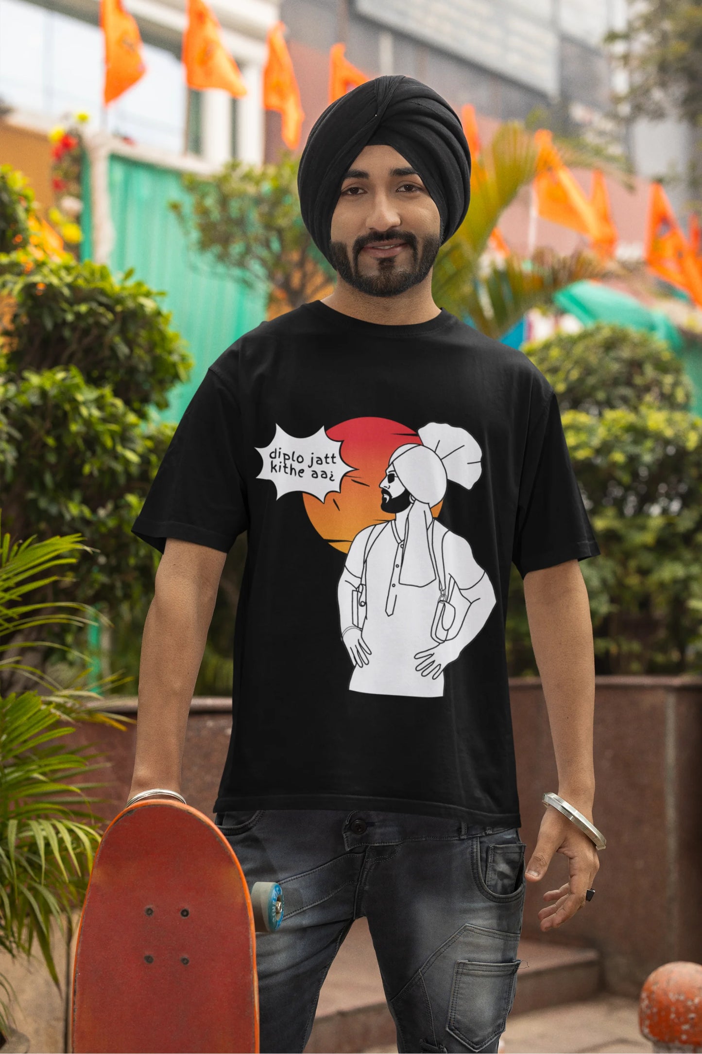Fourth image of a male model wearing a black oversized tshirt with a A portrait of Diljit Dosanjh wearing a stylish outfit, with the text "Diplo Jatt Kithe Aai" prominently displayed in the background. The design captures the artist's charisma and the energy of the hit song, making it a must-have for fans of Diljit Dosanjh and Diplo alike.