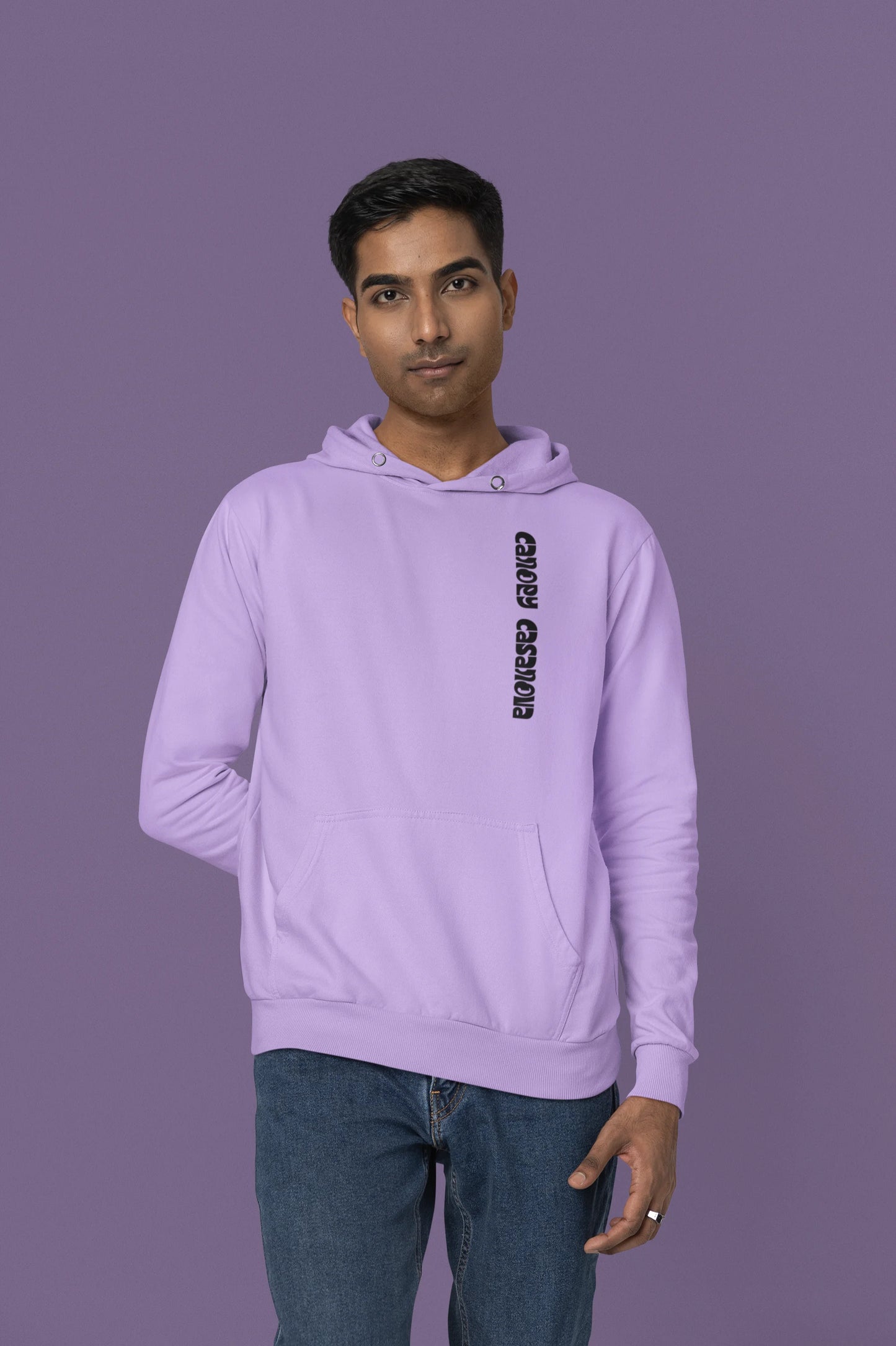 Third front view of a male model wearing a lavender hoodie with a toucan perched on a branch in a jungle setting.