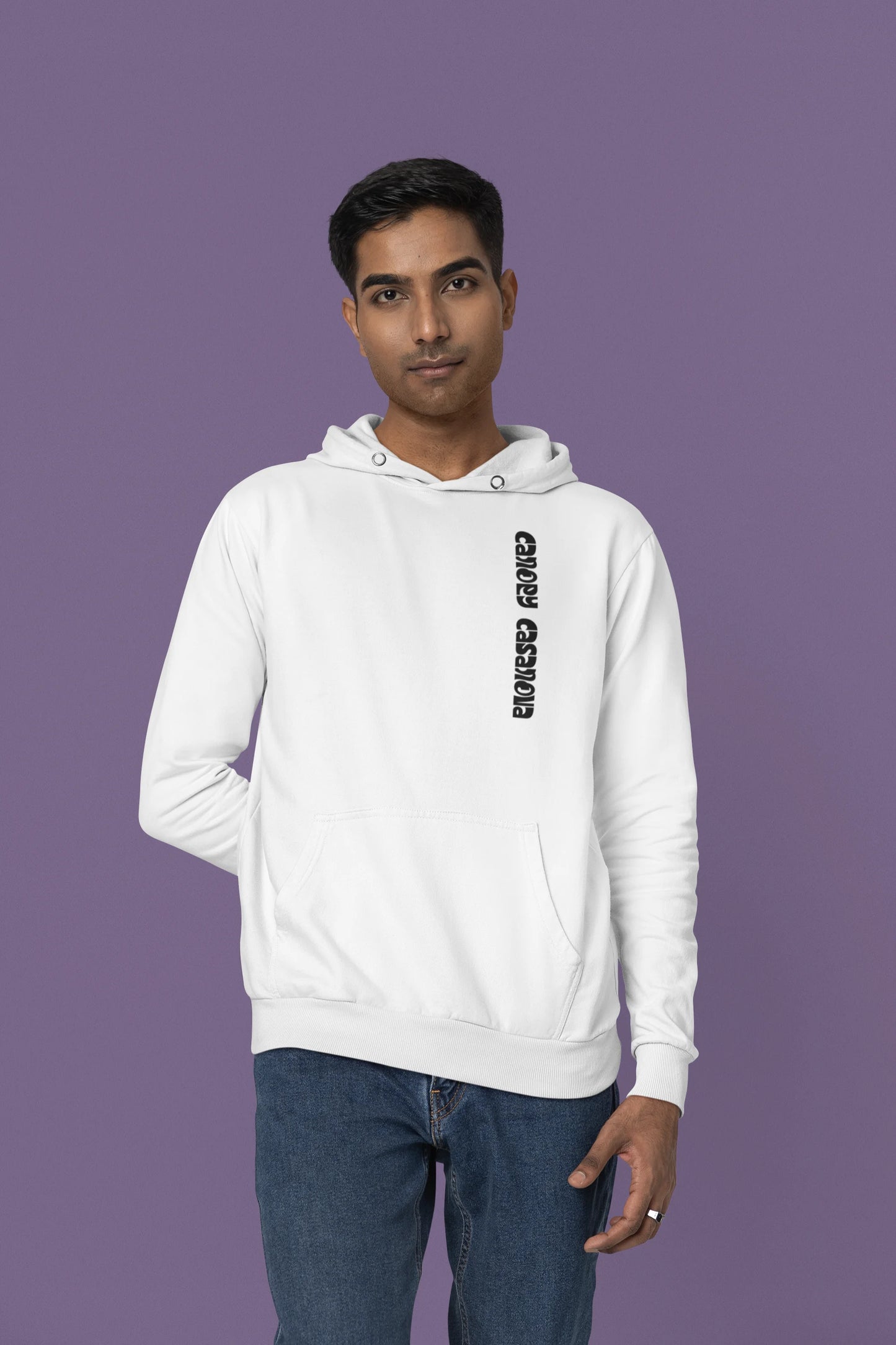 Third front view of a male model wearing a white hoodie with a toucan perched on a branch in a jungle setting.