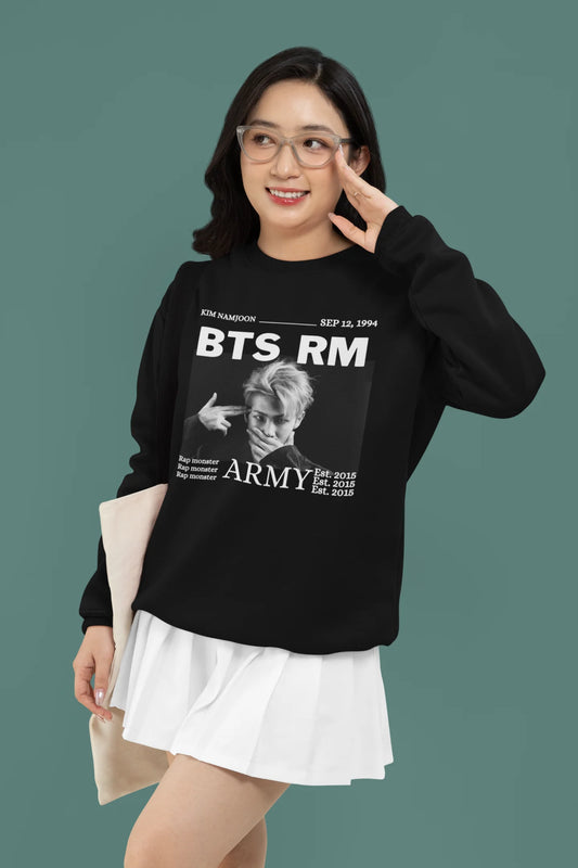 Second front view of female model wearing a black sweatshirt featuring a design representing all seven members of BTS. Ideal for BTS fans (ARMY) who want to show their love for the entire group.