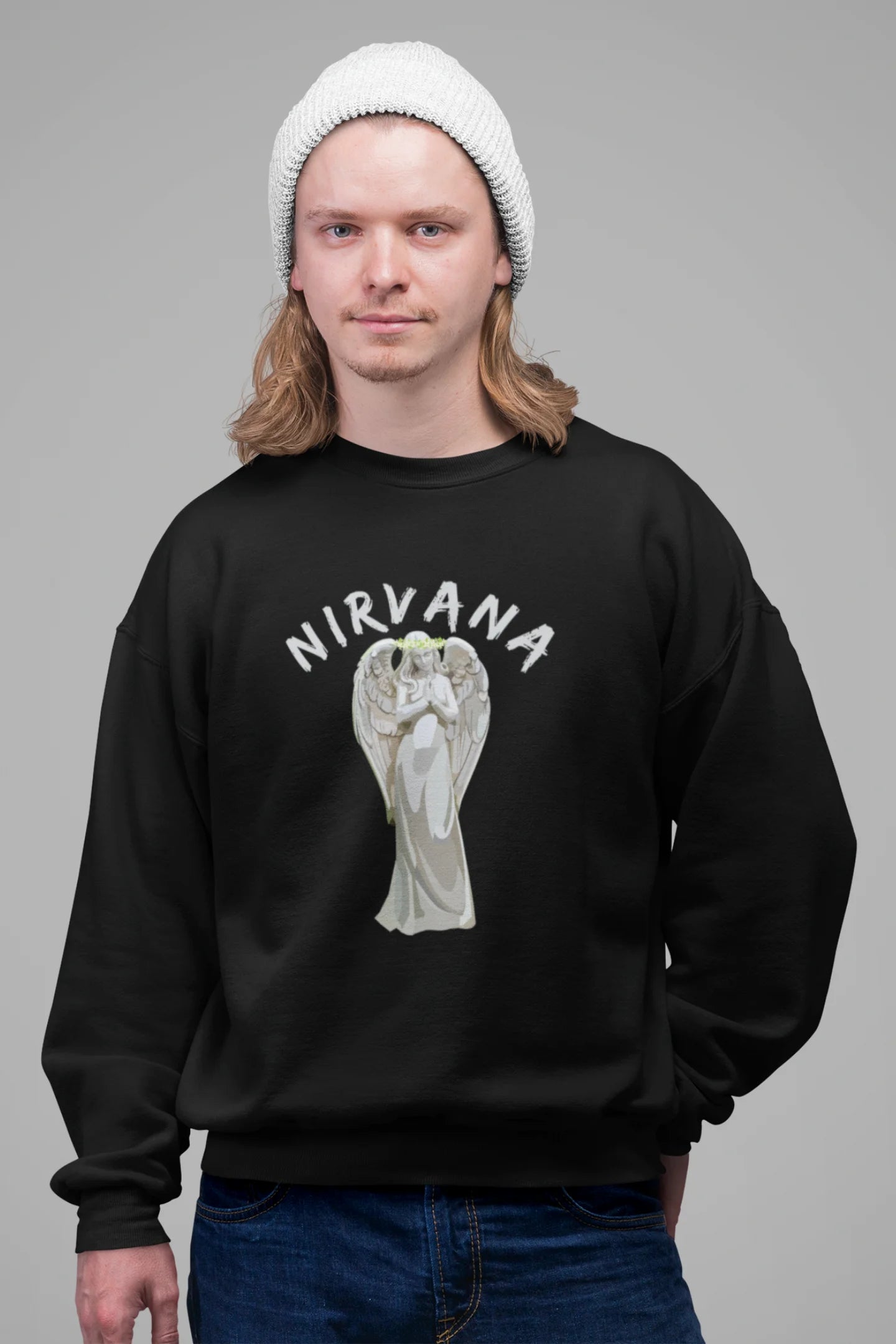 2nd front image of male model wearing a black sweatshirt featuring a design of a winged angel with the text "Nirvana" above it. Ideal for fans of Nirvana and those who love grunge aesthetics.