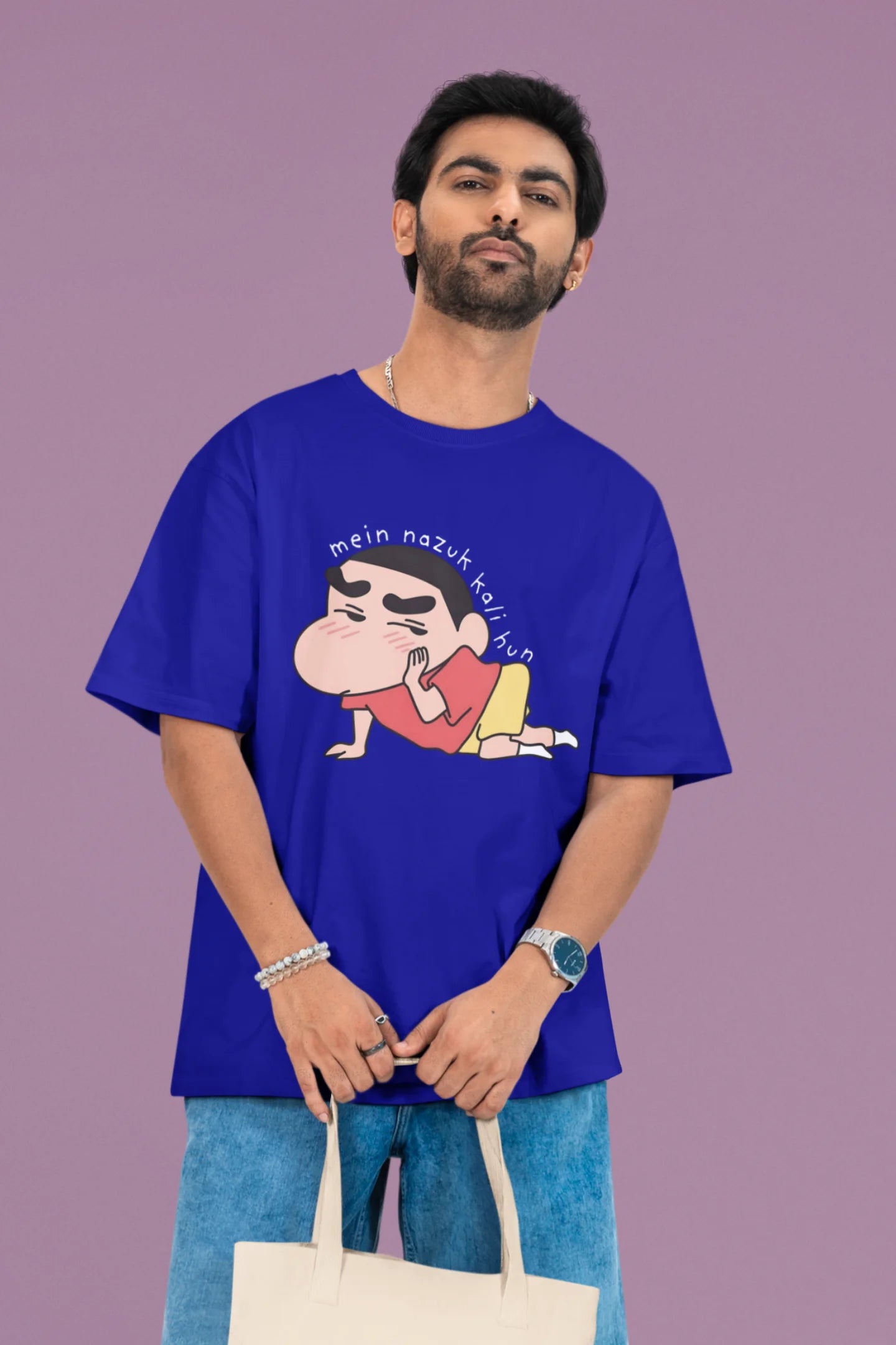 2nd front view of a male model wearing a royal blue oversized t-shirt featuring Shinchan saying "Mein Nazuk Kali Hun."