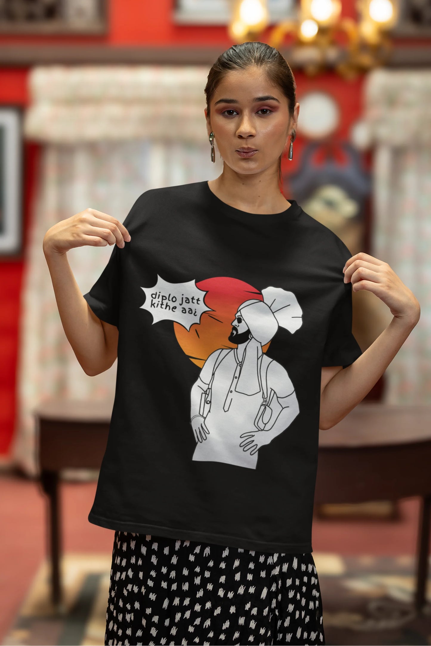Fourth image of a female model wearing a black oversized tshirt with a A portrait of Diljit Dosanjh wearing a stylish outfit, with the text "Diplo Jatt Kithe Aai" prominently displayed in the background. The design captures the artist's charisma and the energy of the hit song, making it a must-have for fans of Diljit Dosanjh and Diplo alike.