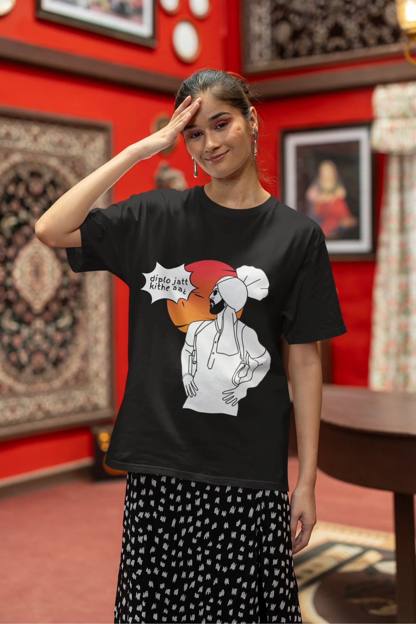Second image of a female model wearing a black oversized tshirt with a A portrait of Diljit Dosanjh wearing a stylish outfit, with the text "Diplo Jatt Kithe Aai" prominently displayed in the background. The design captures the artist's charisma and the energy of the hit song, making it a must-have for fans of Diljit Dosanjh and Diplo alike.