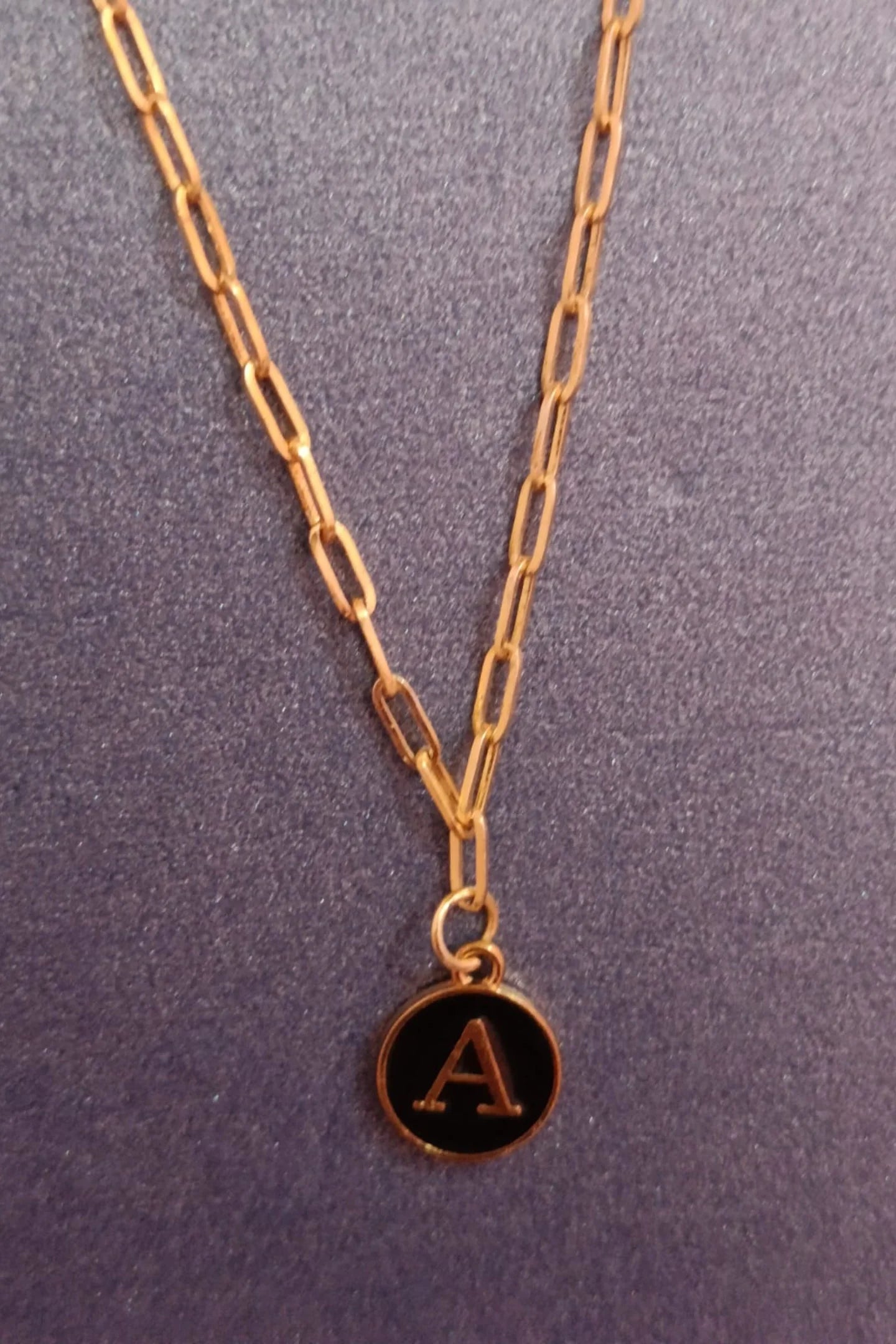 Fourth image of an anti tarnish gold chain necklace featuring personalized initials.