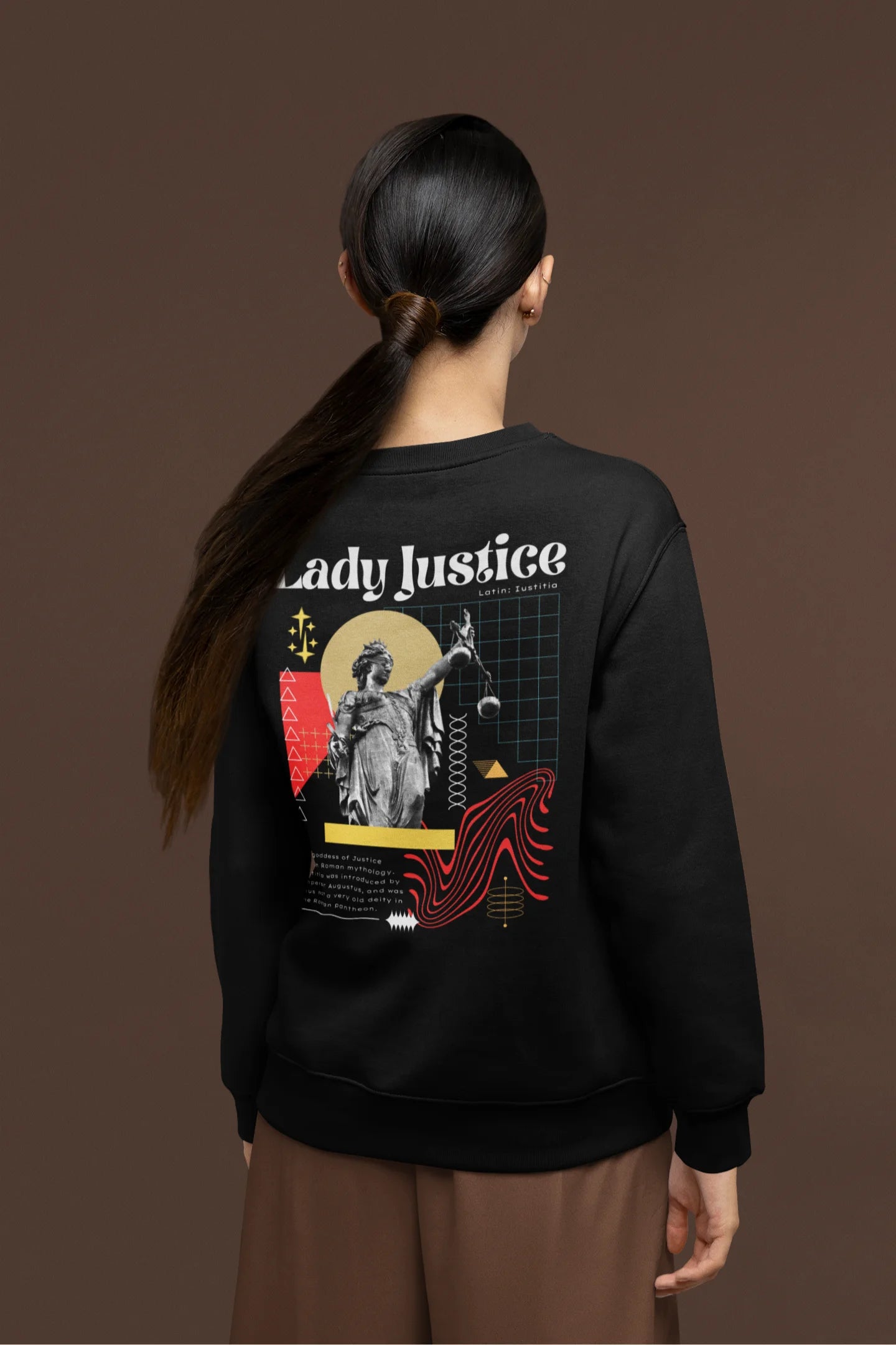 Back view of a female model wearing a black sweatshirt with a brutalist Lady Justice statue design.