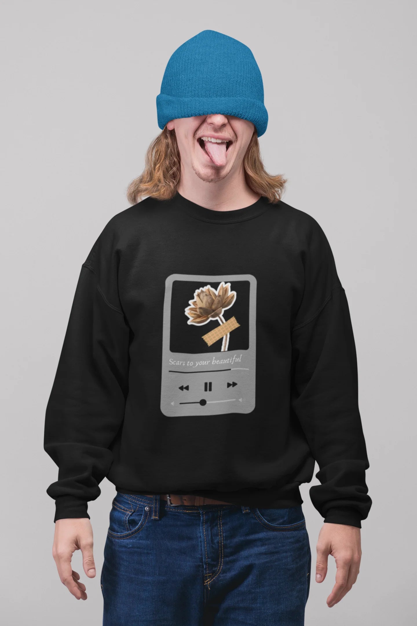 First front view of a male model wearing a black sweatshirt featuring a design inspired by Alessia Cara's song "Scars to Your Beautiful." The design includes flowers and a message of self-love. Ideal for fans of Alessia Cara and those who appreciate messages of empowerment.