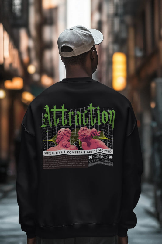 First back view of a male model wearing a black sweatshirt with a brutalist design featuring two statues kissing and the word "Attraction".
