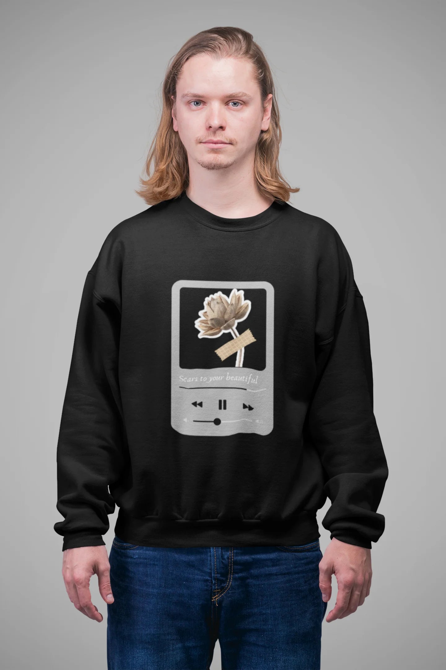 3rd front view of a male model wearing a black sweatshirt featuring a design inspired by Alessia Cara's song "Scars to Your Beautiful." The design includes flowers and a message of self-love. Ideal for fans of Alessia Cara and those who appreciate messages of empowerment.